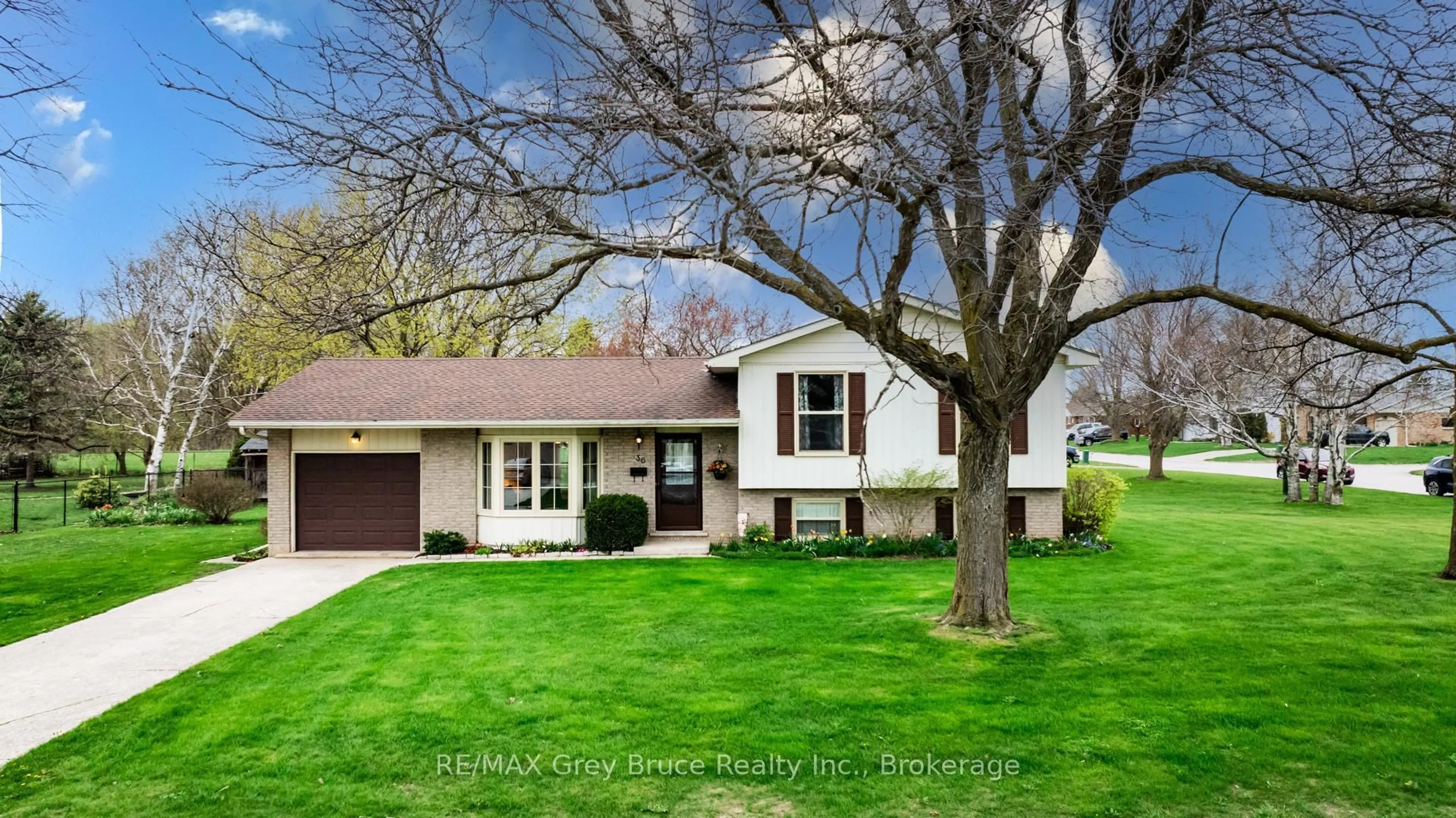 Home with vinyl exterior material, street for 36 Centennial St, Arran-Elderslie Ontario N0G 1L0