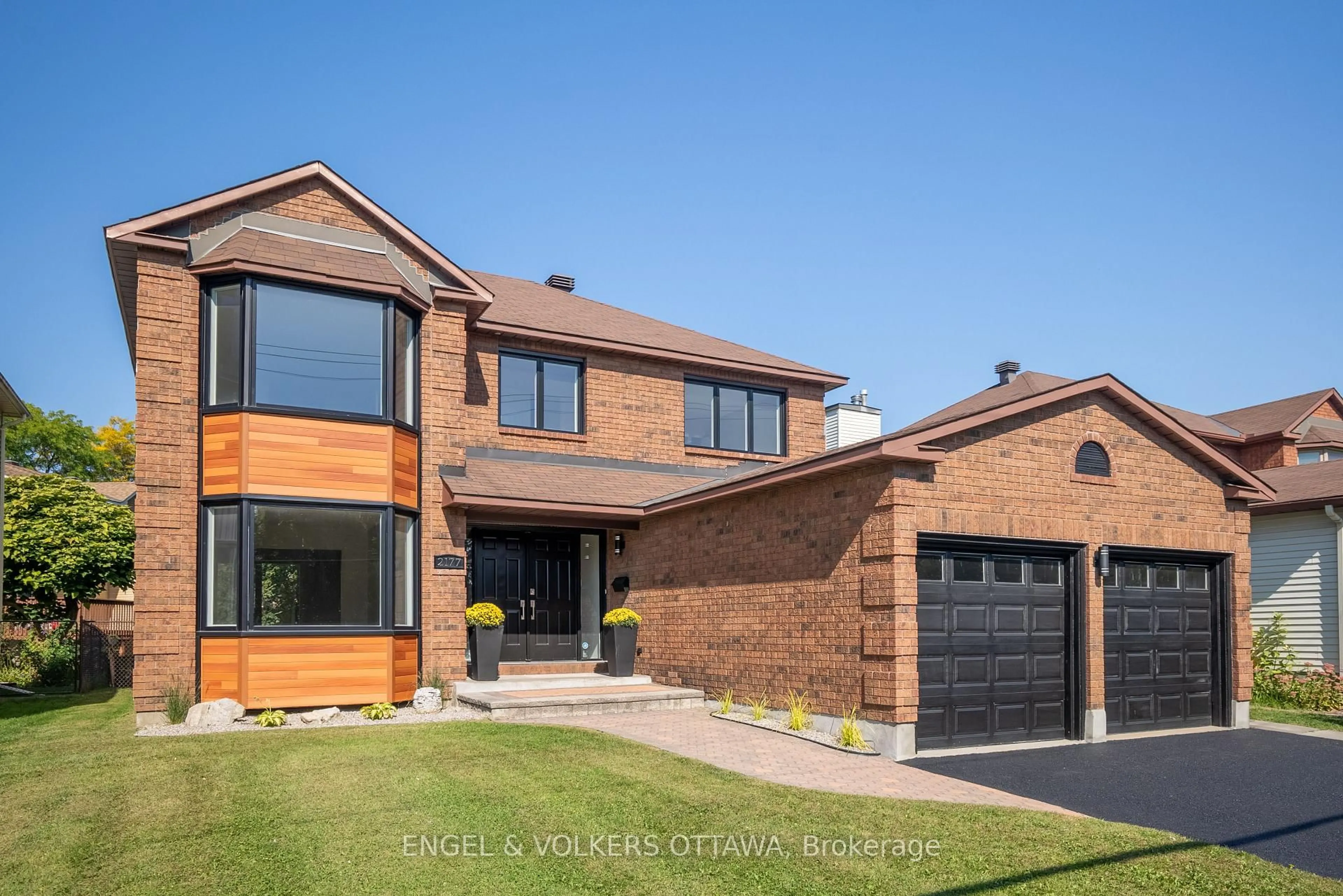 Home with brick exterior material, street for 2177 Lenester Ave, Ottawa Ontario K2A 4A9