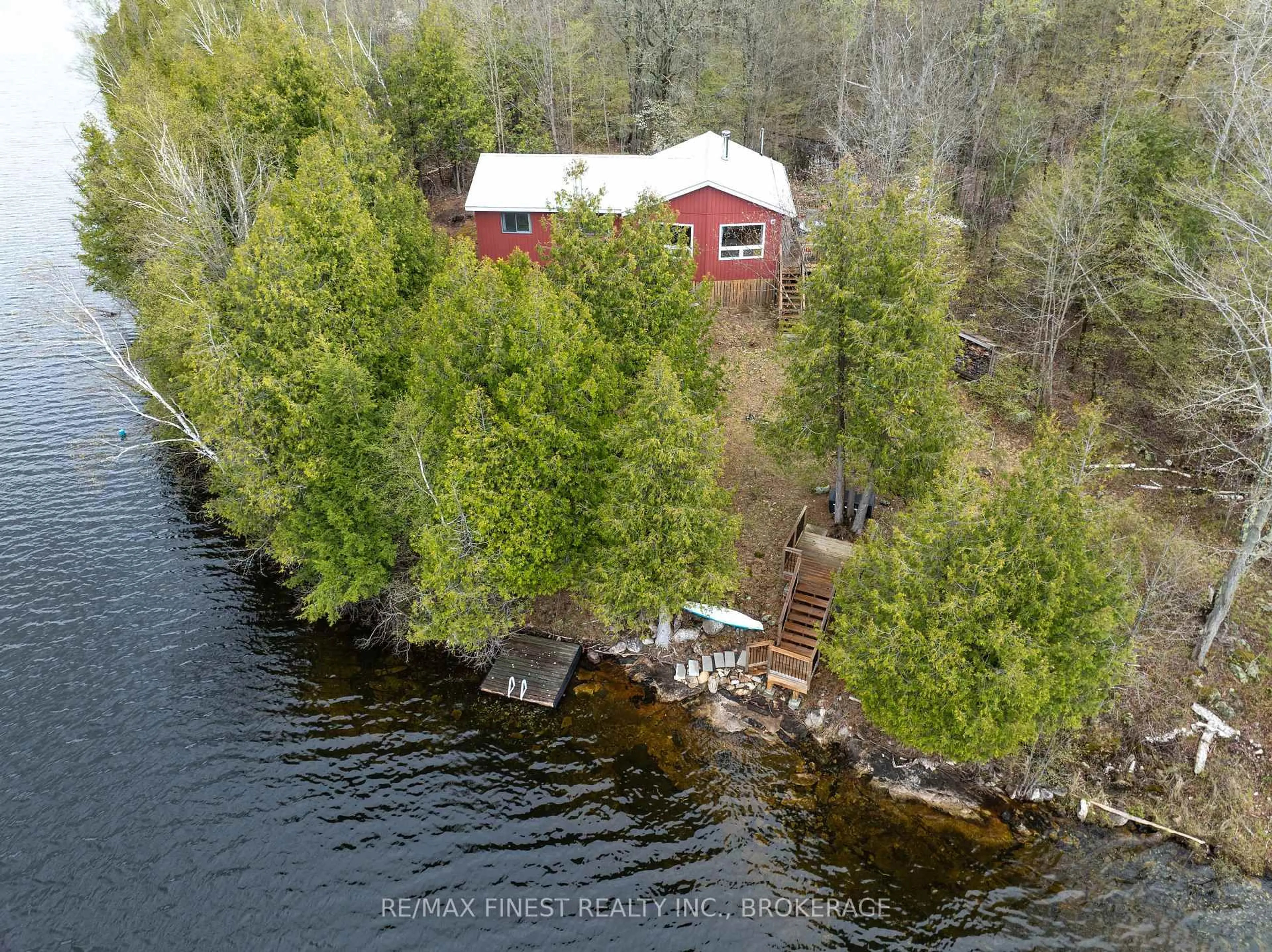 A pic from outside/outdoor area/front of a property/back of a property/a pic from drone, water/lake/river/ocean view for 1407 St Andrews Lake Lane, Godfrey Ontario K0H 1T0