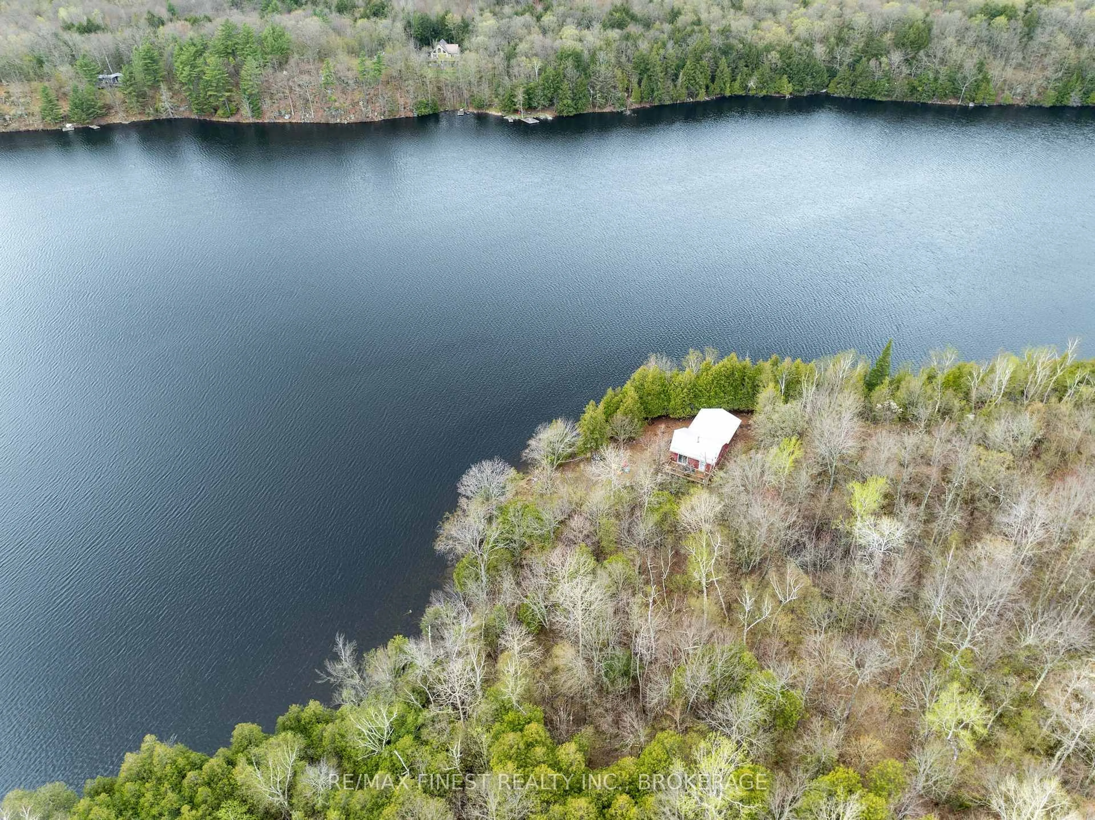 A pic from outside/outdoor area/front of a property/back of a property/a pic from drone, water/lake/river/ocean view for 1407 St Andrews Lake Lane, Godfrey Ontario K0H 1T0