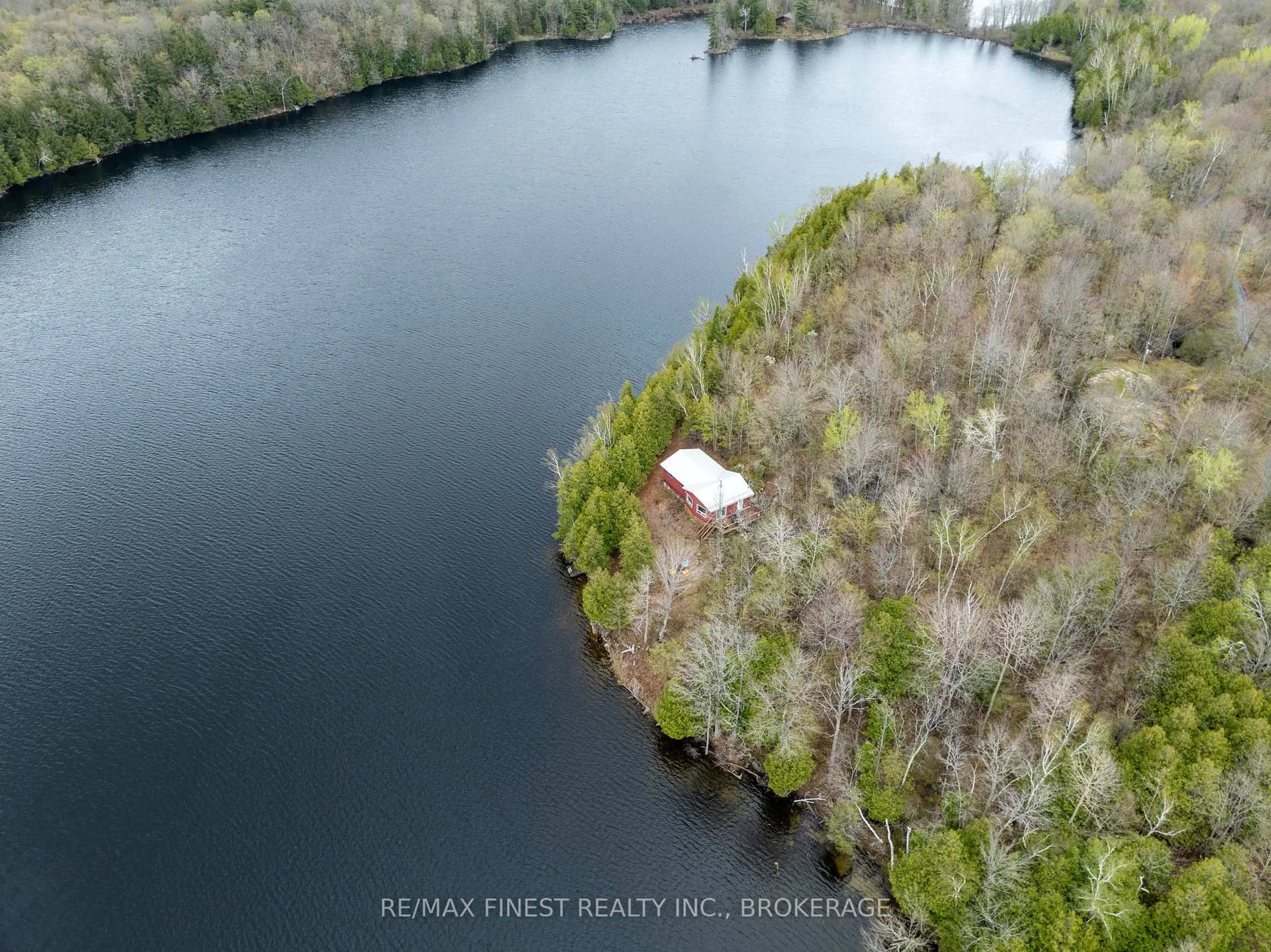 A pic from outside/outdoor area/front of a property/back of a property/a pic from drone, water/lake/river/ocean view for 1407 St Andrews Lake Lane, Godfrey Ontario K0H 1T0