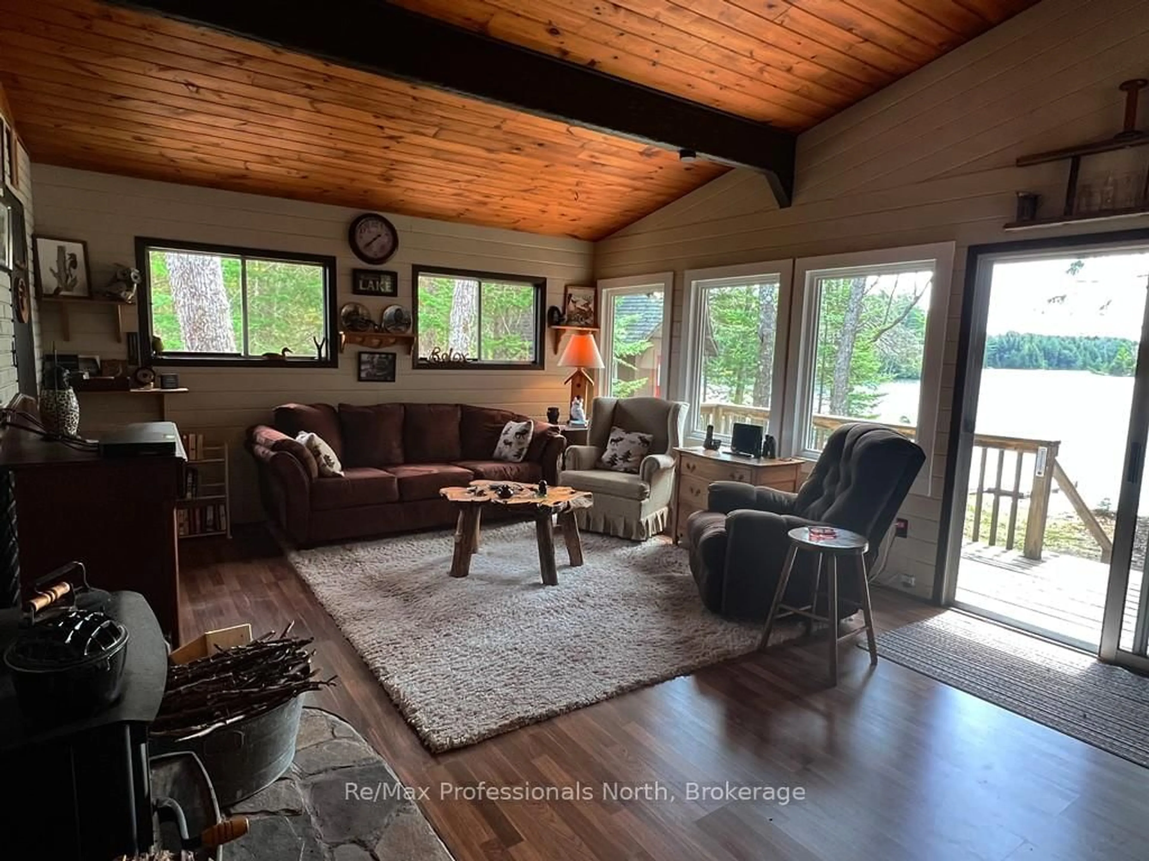 Living room with furniture, wood/laminate floor for 1069 Cohosh Lane, Dysart et al Ontario K0L 1X0