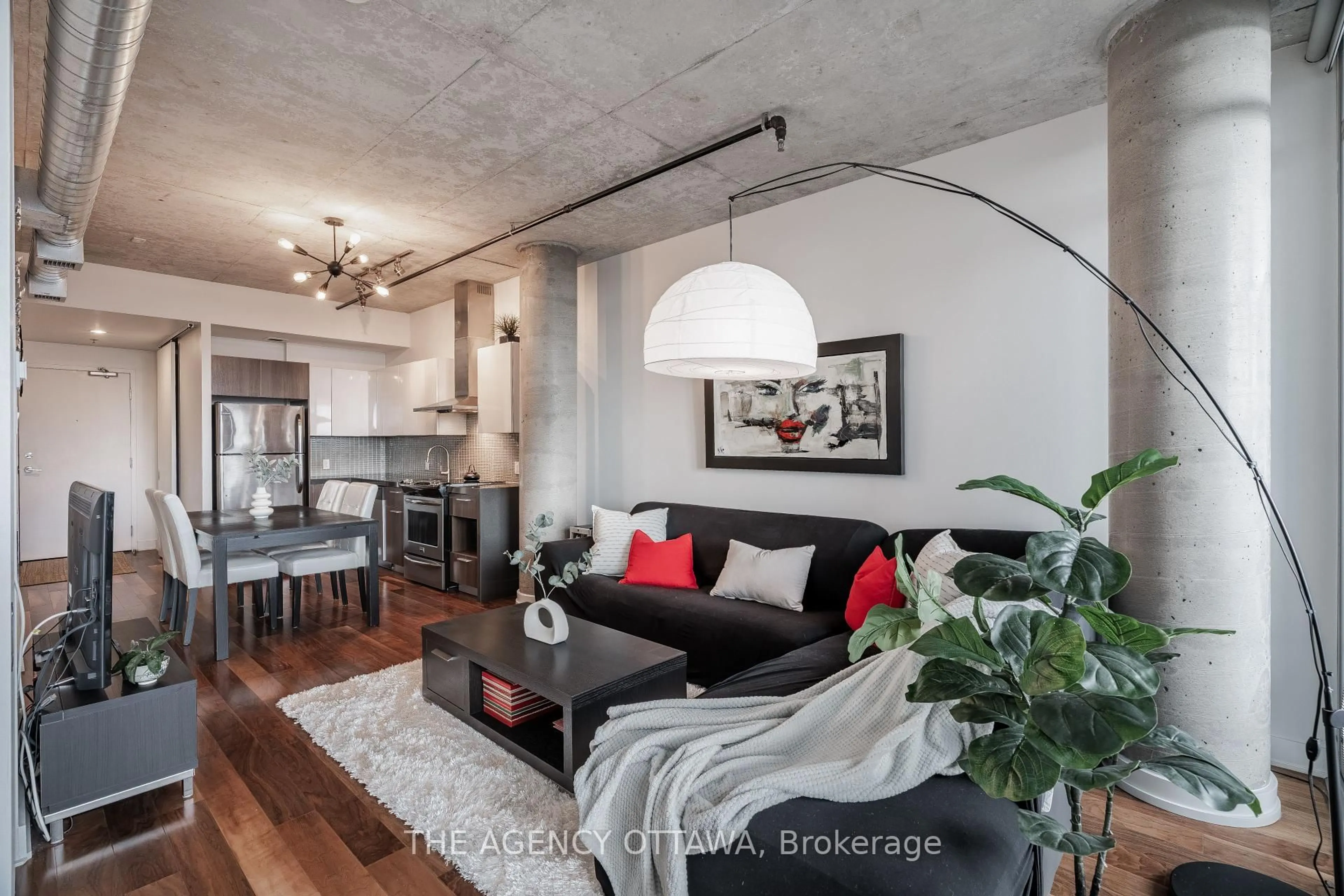 Living room with furniture, cement floor for 360 Mcleod St #620, Ottawa Ontario K2P 1A9