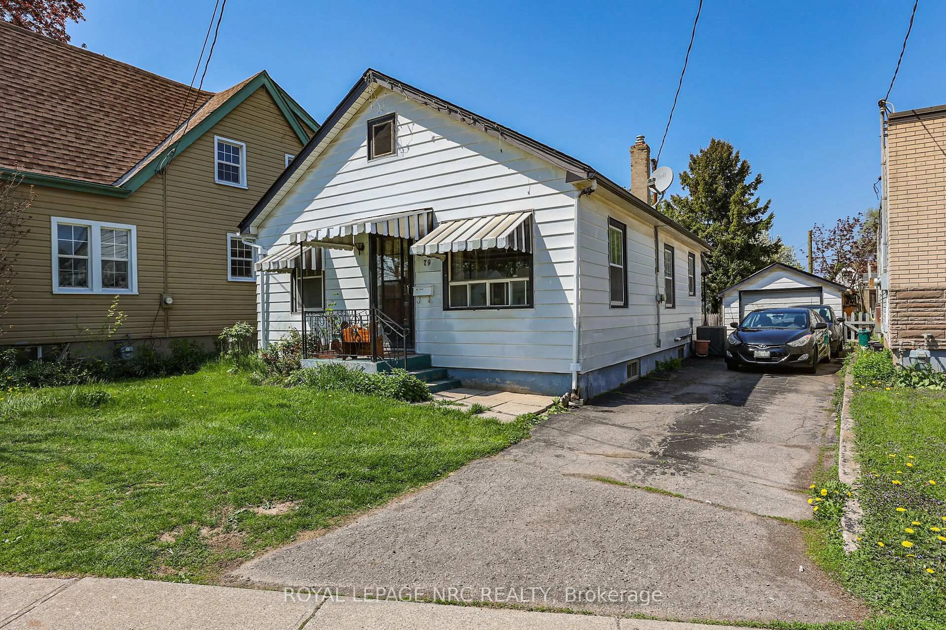 Home with vinyl exterior material, street for 79 Carlton St, St. Catharines Ontario L2R 1R1