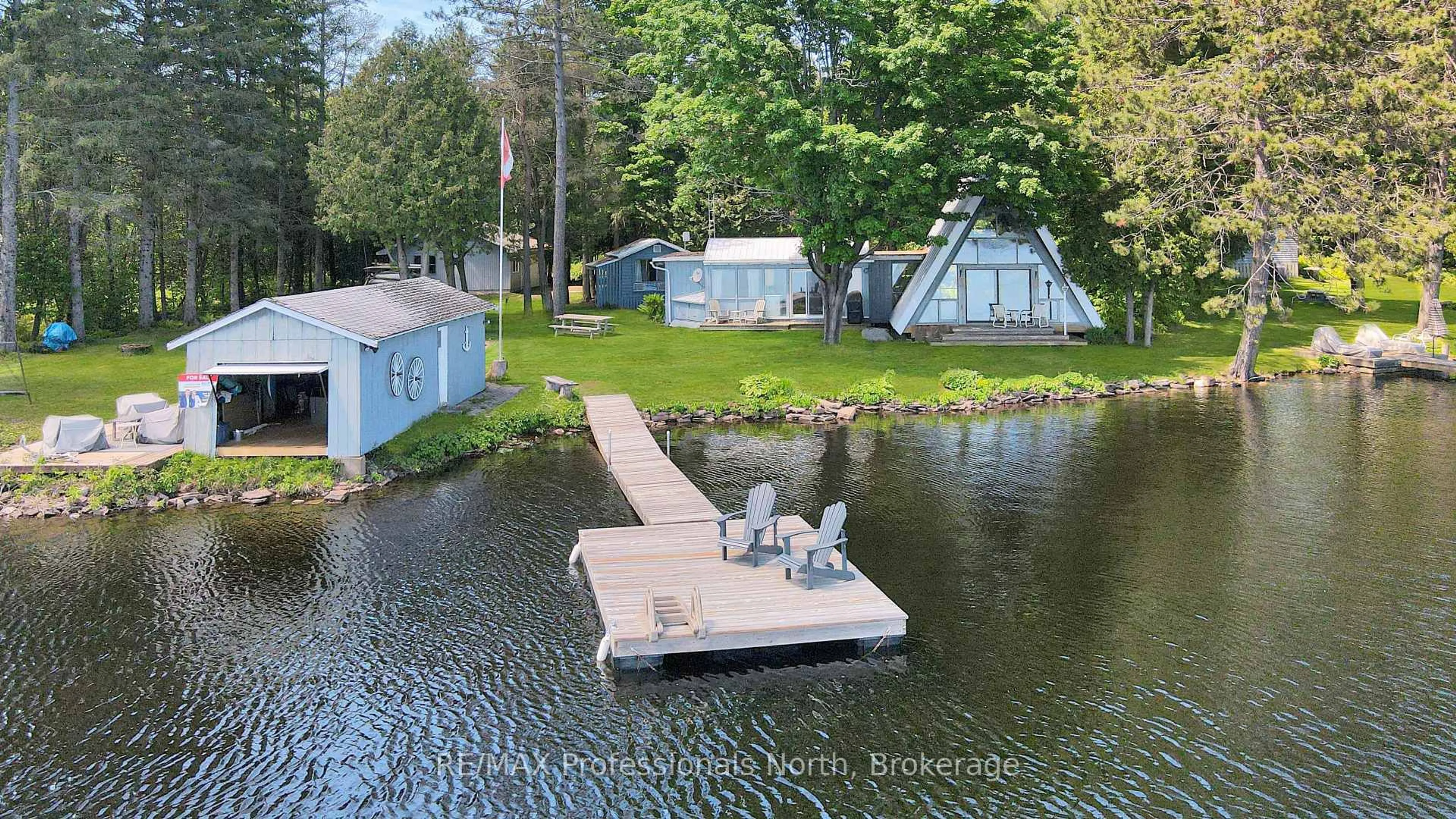 A pic from outside/outdoor area/front of a property/back of a property/a pic from drone, water/lake/river/ocean view for 1013 TWIN ROCKS Lane, Algonquin Highlands Ontario K0M 2K0