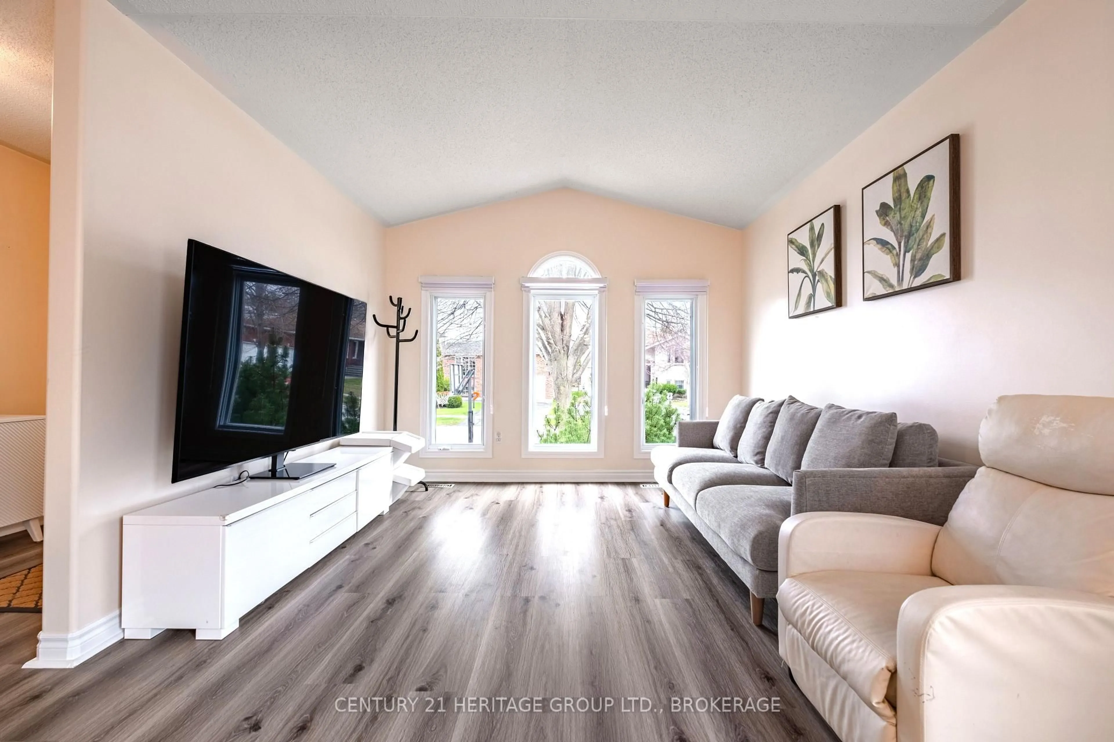 Living room with furniture, wood/laminate floor for 498 Barnsley Cres, Kingston Ontario K7M 8X2