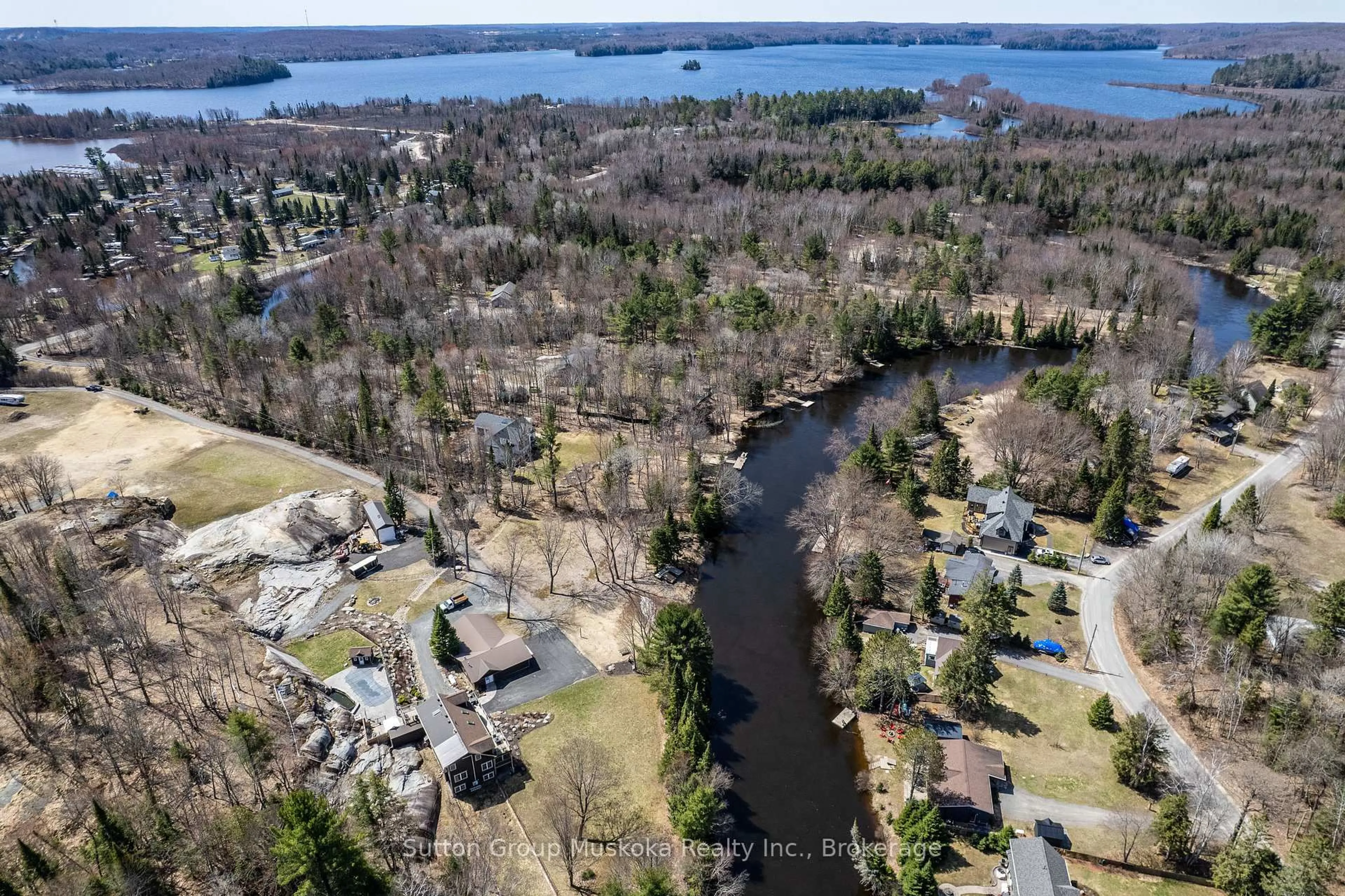 A pic from outside/outdoor area/front of a property/back of a property/a pic from drone, water/lake/river/ocean view for 15 Glen Acres Rd, Huntsville Ontario P1H 1N6