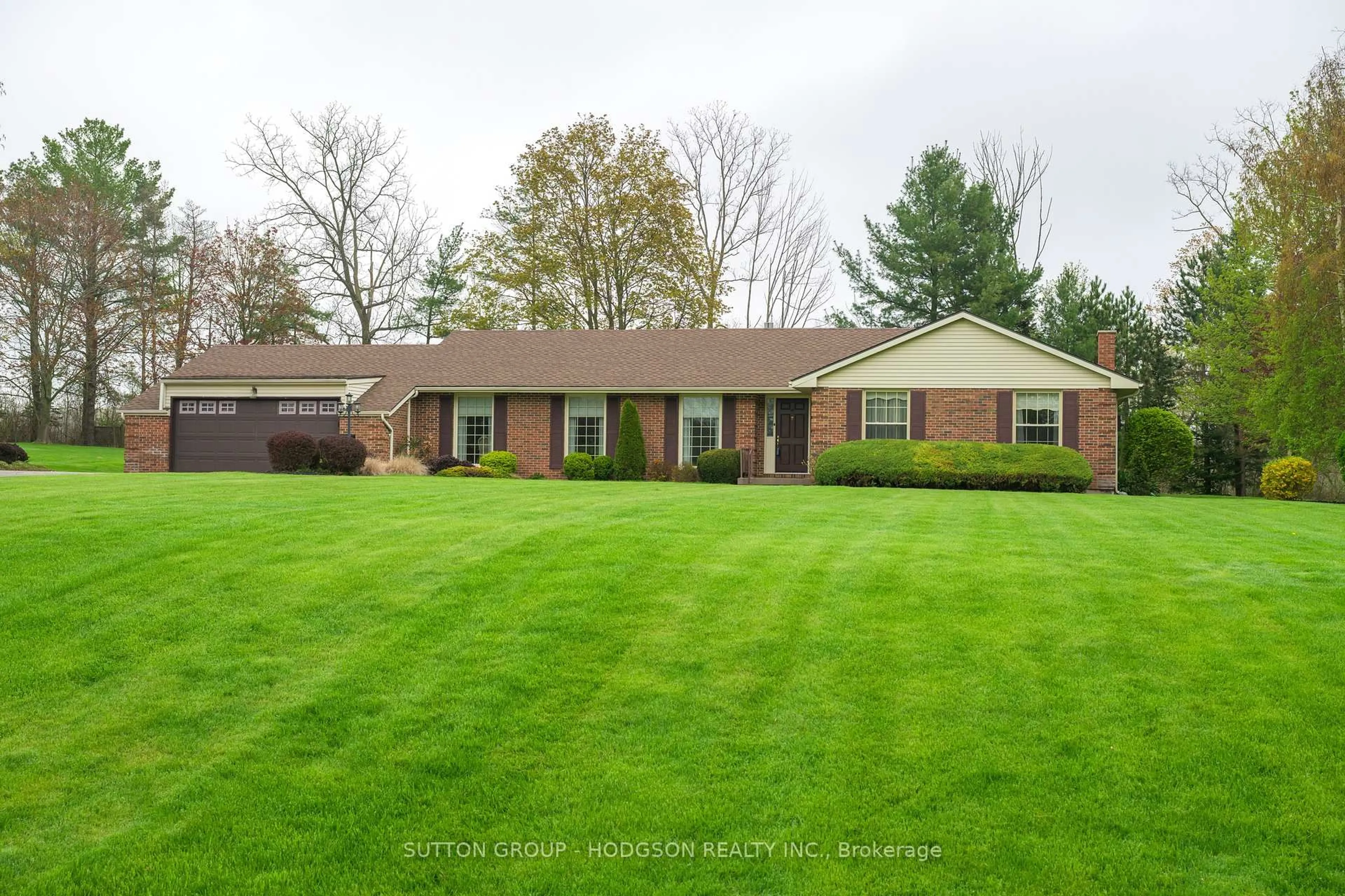 Home with brick exterior material, street for 42776 Meadow Wood Lane, Central Elgin Ontario N0L 2L0