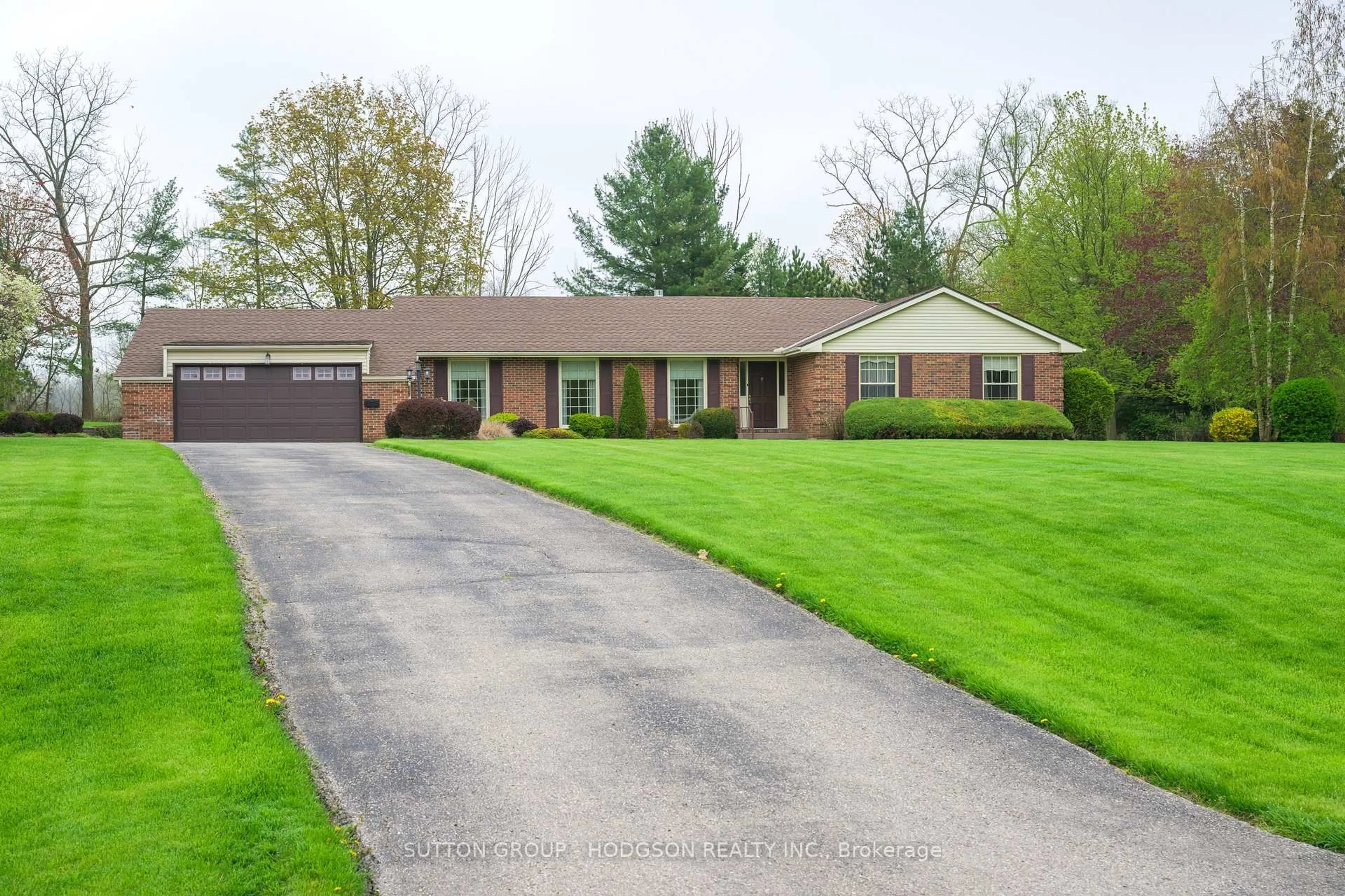 Home with brick exterior material, street for 42776 Meadow Wood Lane, Central Elgin Ontario N0L 2L0