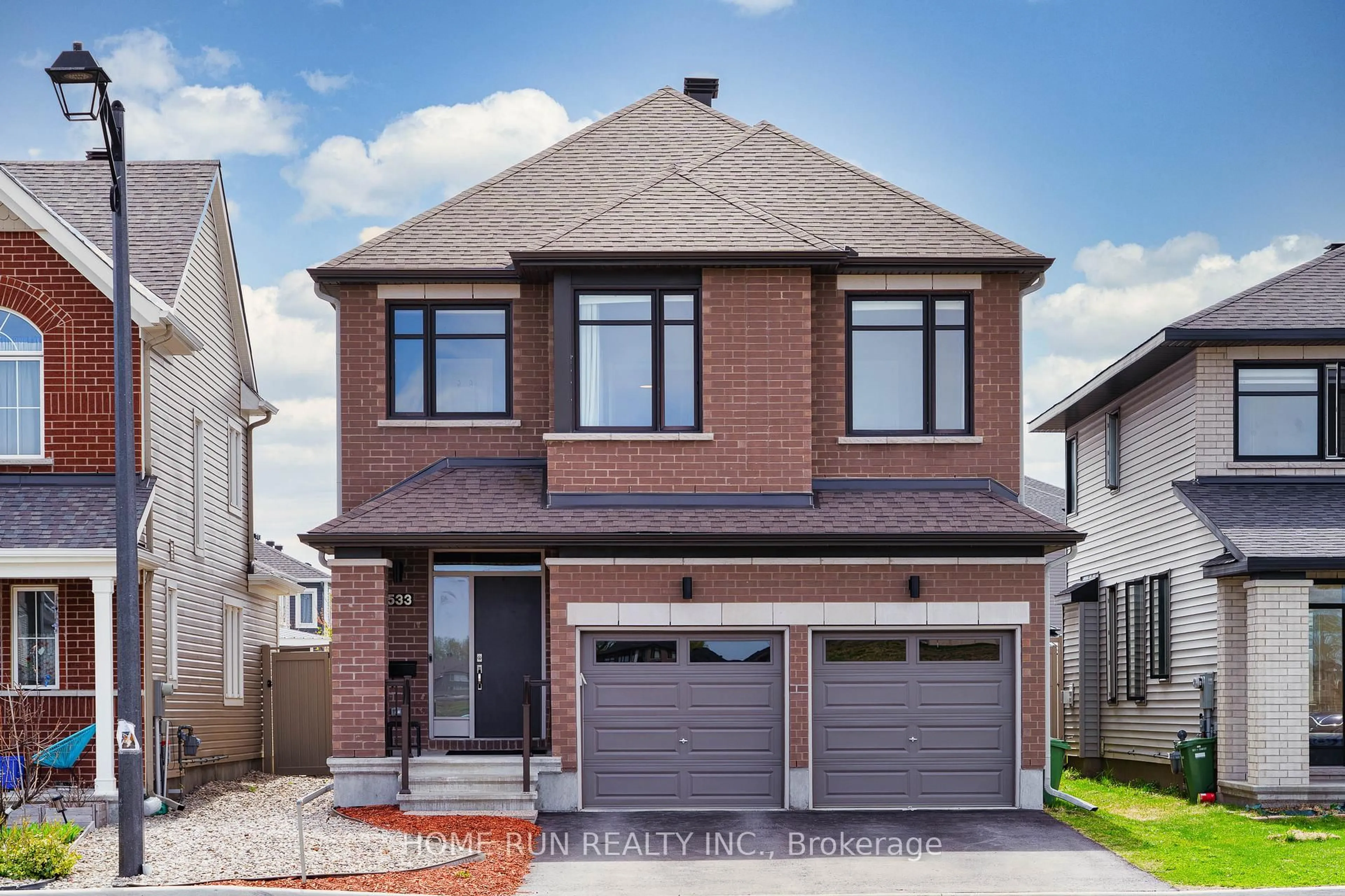 Home with brick exterior material, street for 533 Honeylocust Ave, Stittsville Ontario K2V 0L8