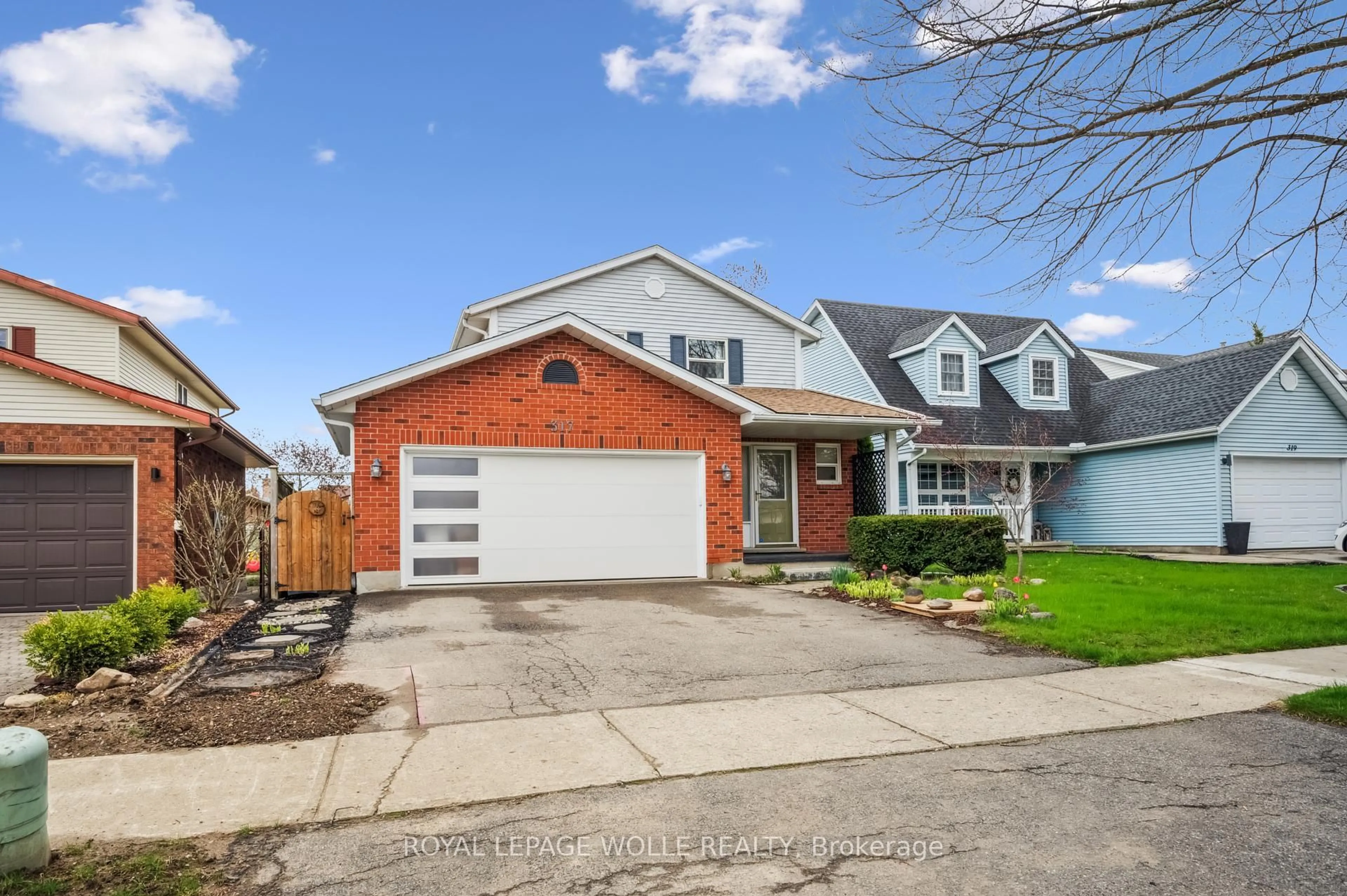 Home with brick exterior material, street for 317 Bushview Cres, Waterloo Ontario N2V 2A6