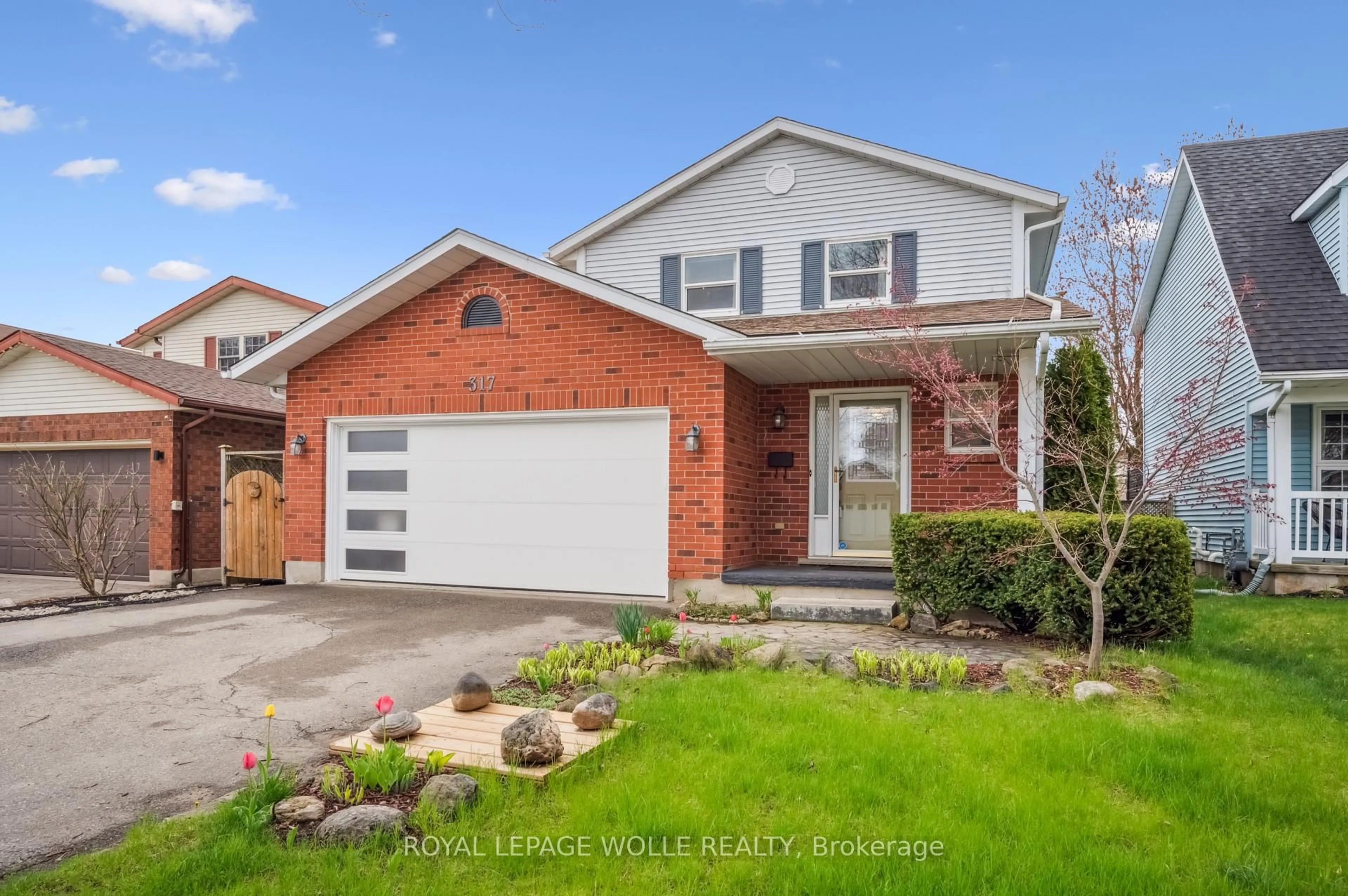 Home with brick exterior material, street for 317 Bushview Cres, Waterloo Ontario N2V 2A6