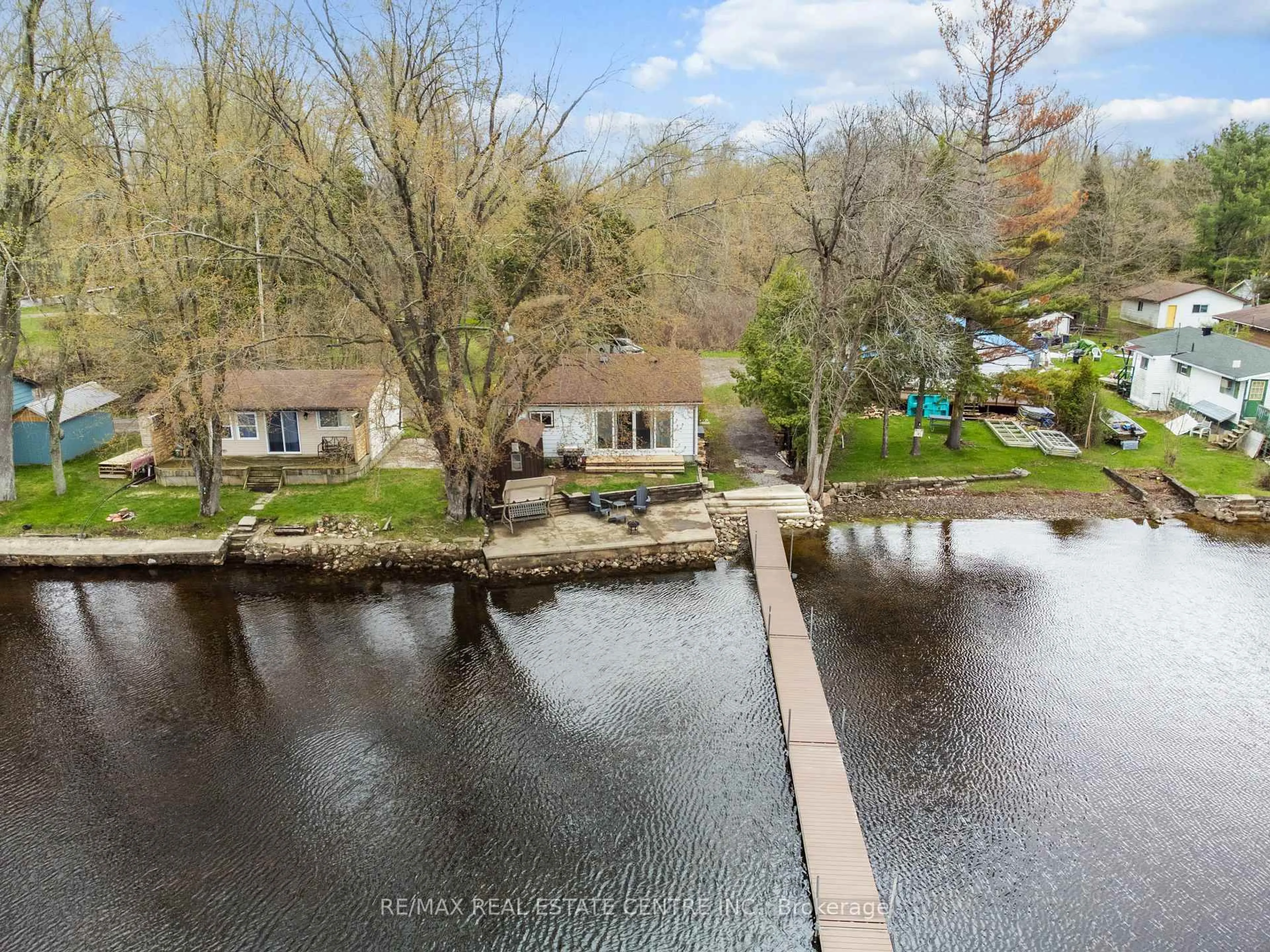 A pic from outside/outdoor area/front of a property/back of a property/a pic from drone, water/lake/river/ocean view for 105 Hughes Lane, Tweed Ontario K0K 3J0
