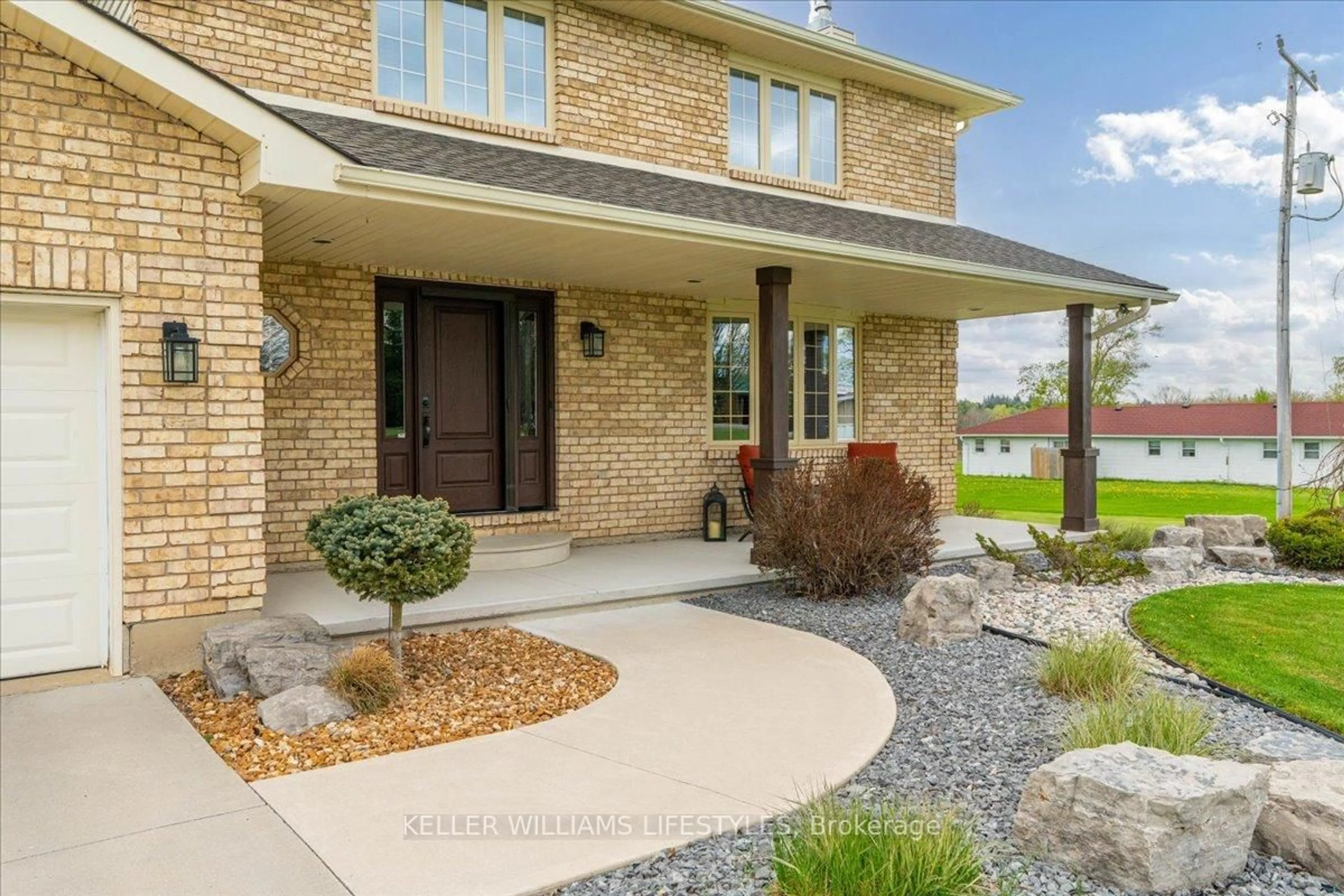 Home with brick exterior material, street for 7512 Arkona Rd, Lambton Shores Ontario N0M 1B0