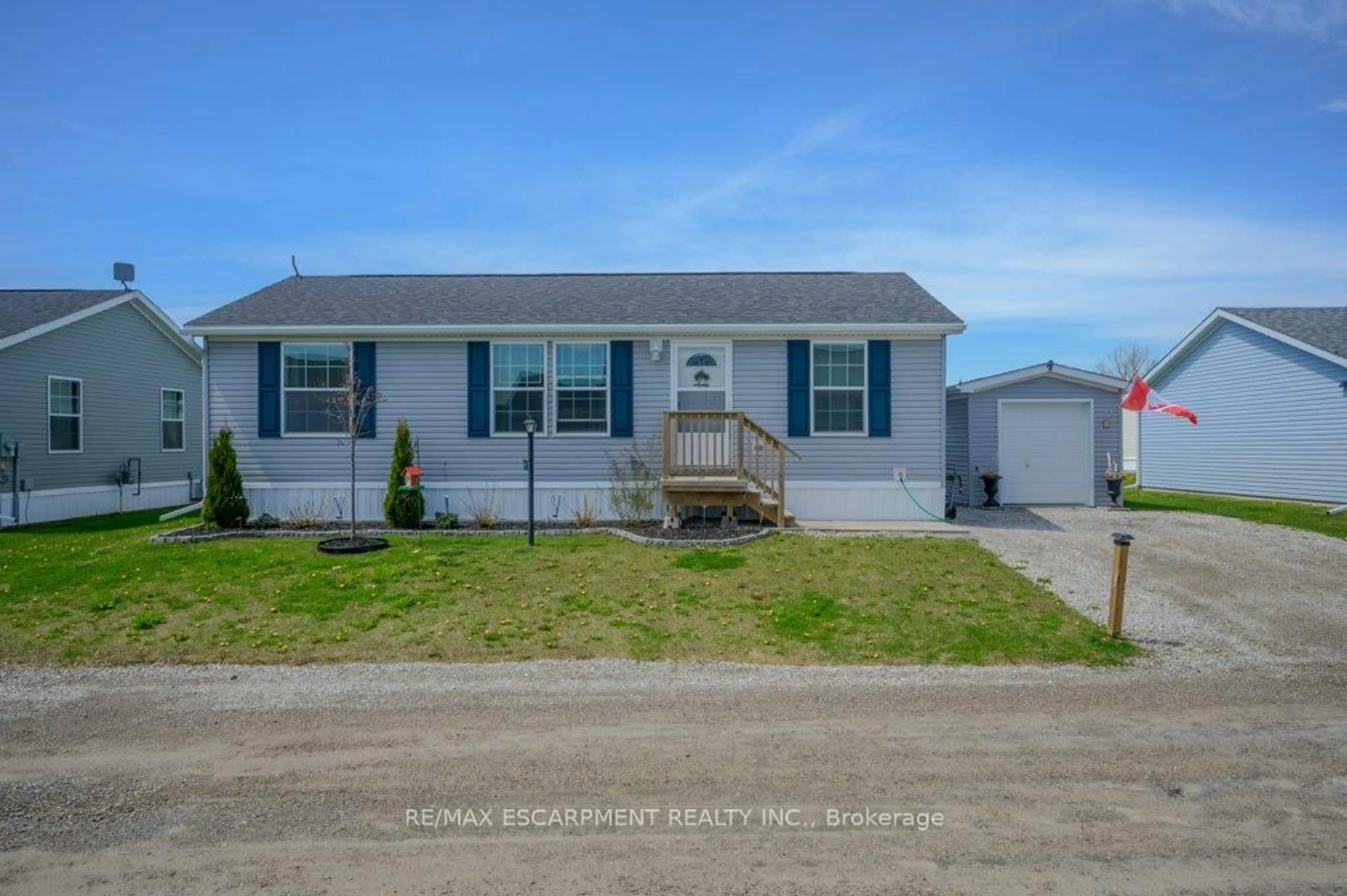 Home with vinyl exterior material, street for 9 Copper Beech Dr, Haldimand Ontario N0A 1L0