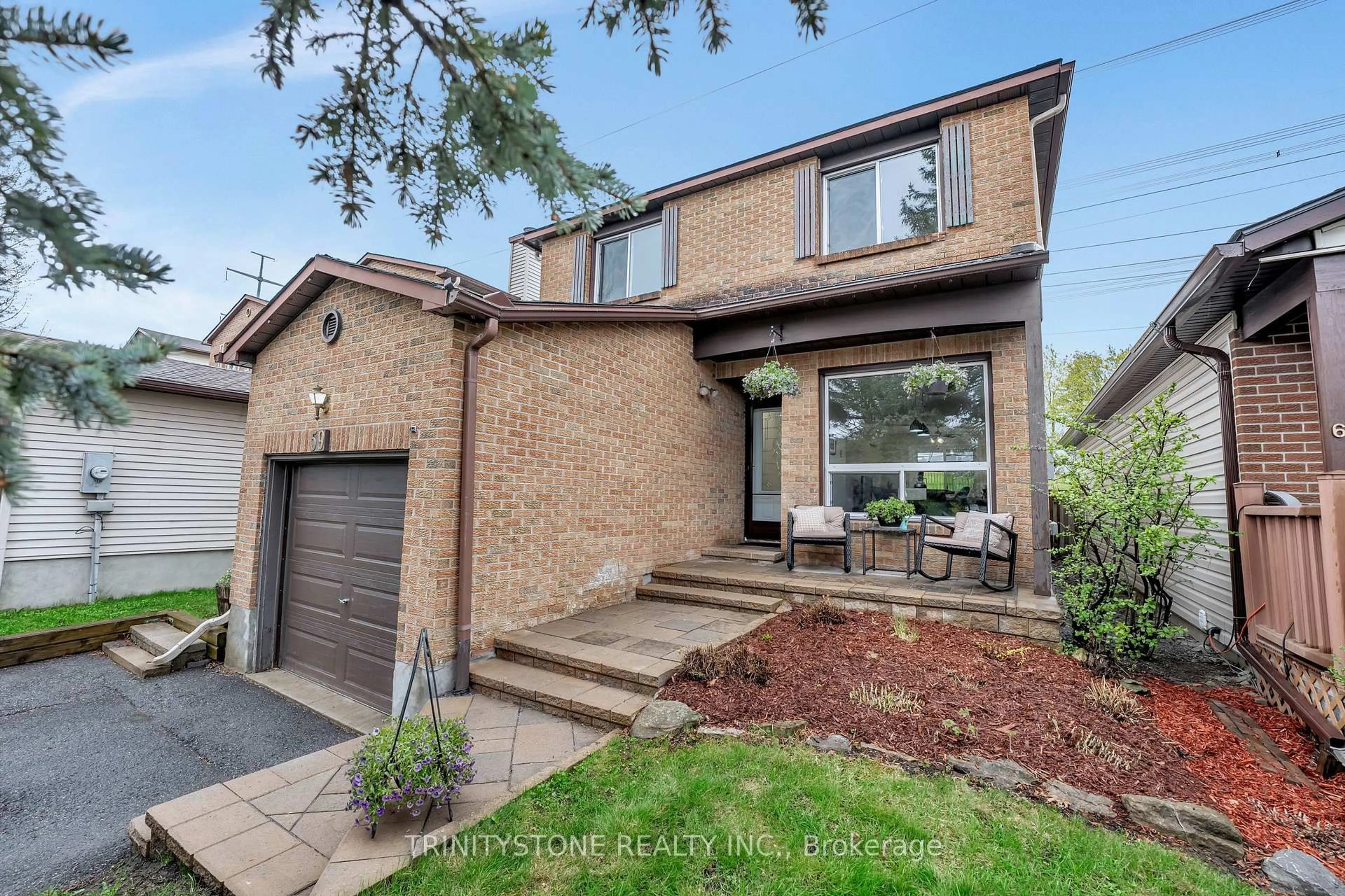 Home with brick exterior material, street for 59 Stable Way, Kanata Ontario K2M 1A8