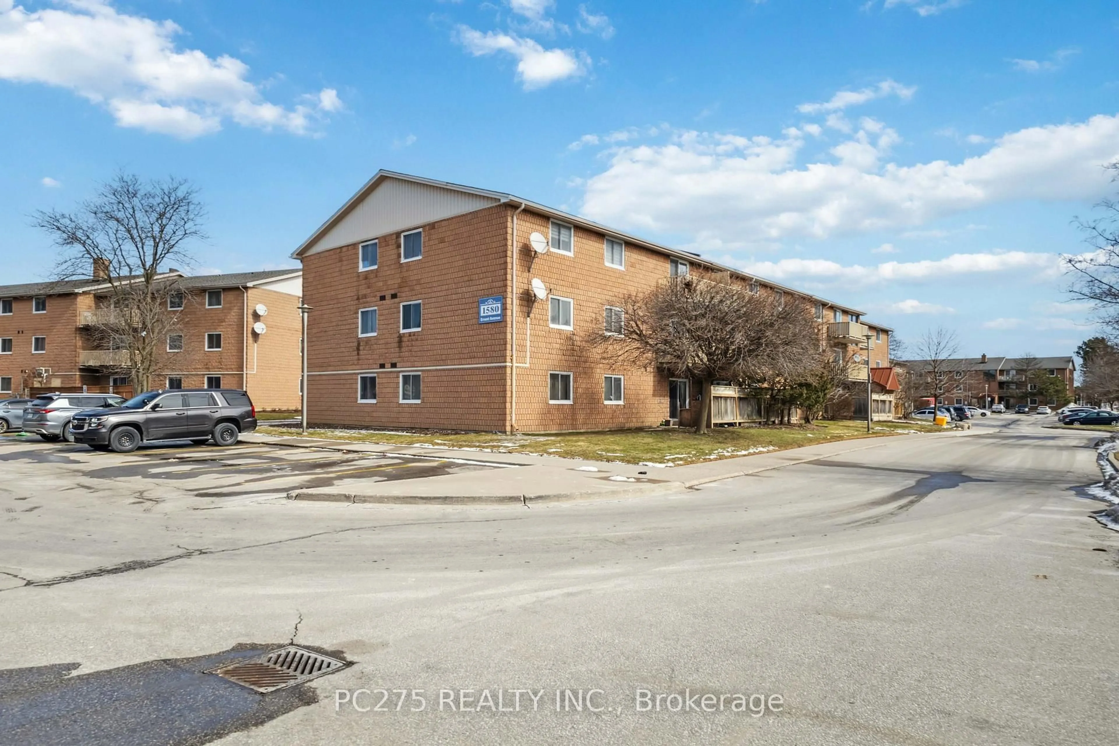 A pic from outside/outdoor area/front of a property/back of a property/a pic from drone, street for 1580 Ernest Ave #105, London South Ontario N6E 2T9