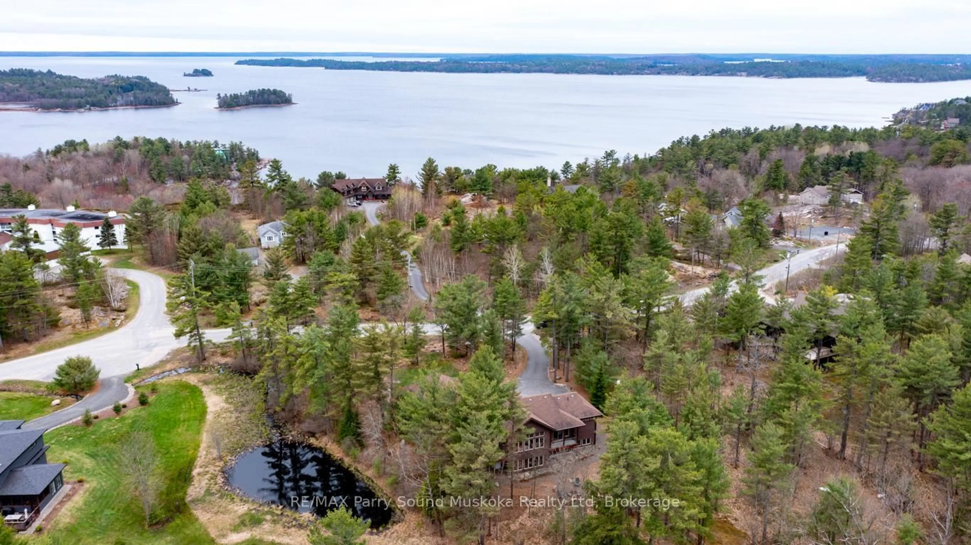 A pic from outside/outdoor area/front of a property/back of a property/a pic from drone, water/lake/river/ocean view for 25 Ryder Dr, McDougall Ontario P2A 2W9