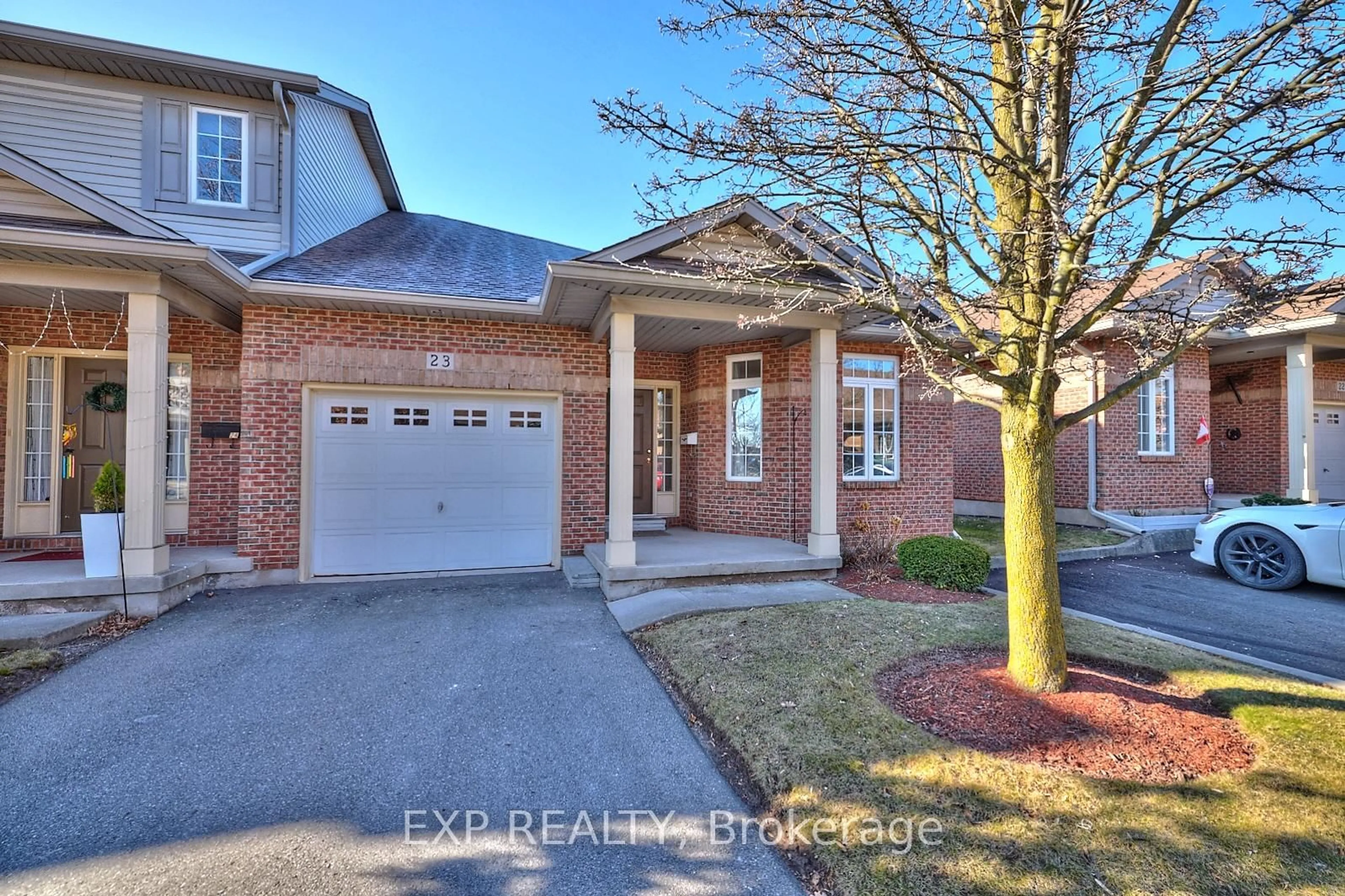 Home with brick exterior material, street for 5595 DRUMMOND Rd #23, Niagara Falls Ontario L2G 4L2