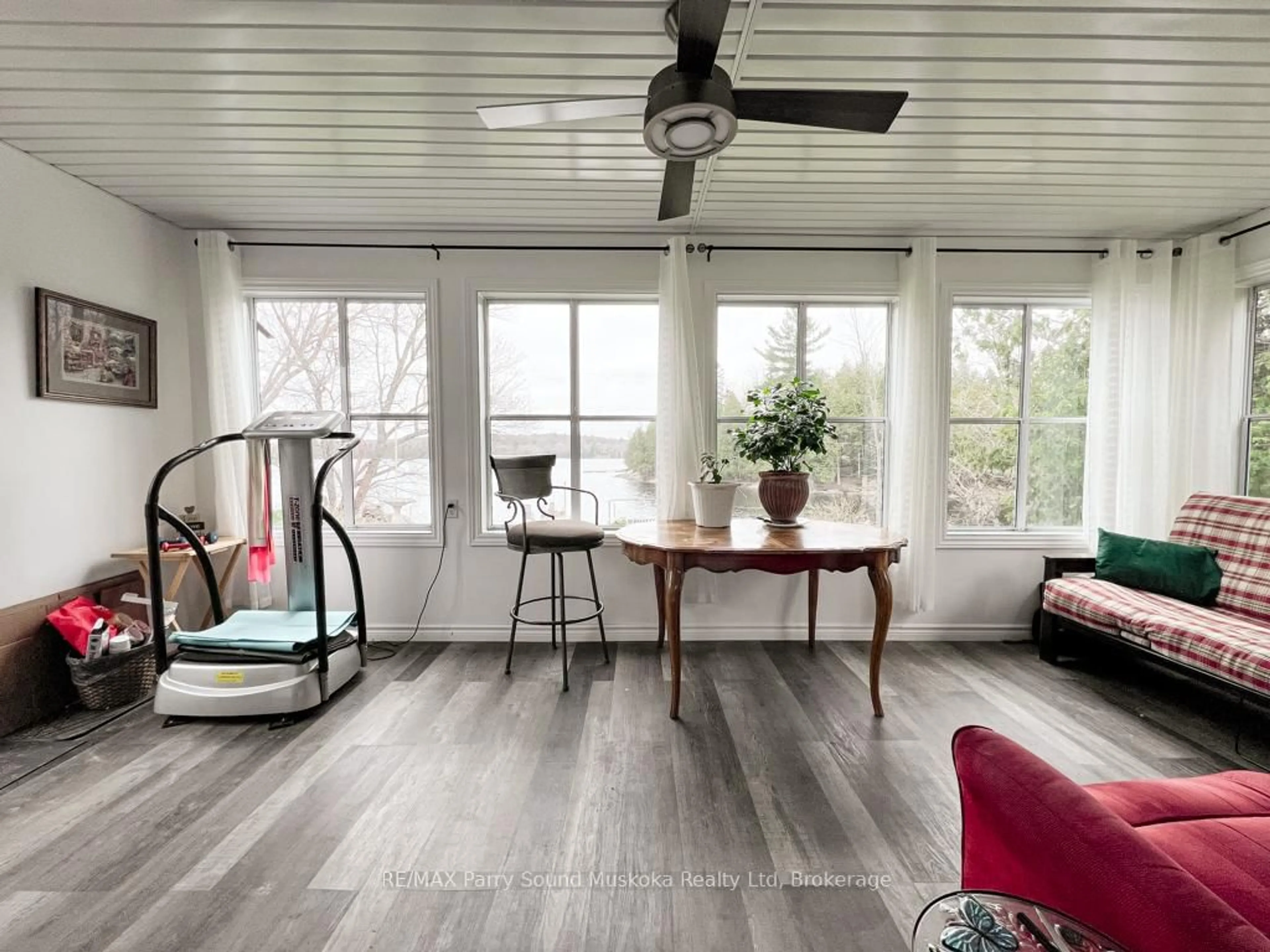 Living room with furniture, wood/laminate floor for 21 Macfie Rd, Whitestone Ontario P0A 1G0