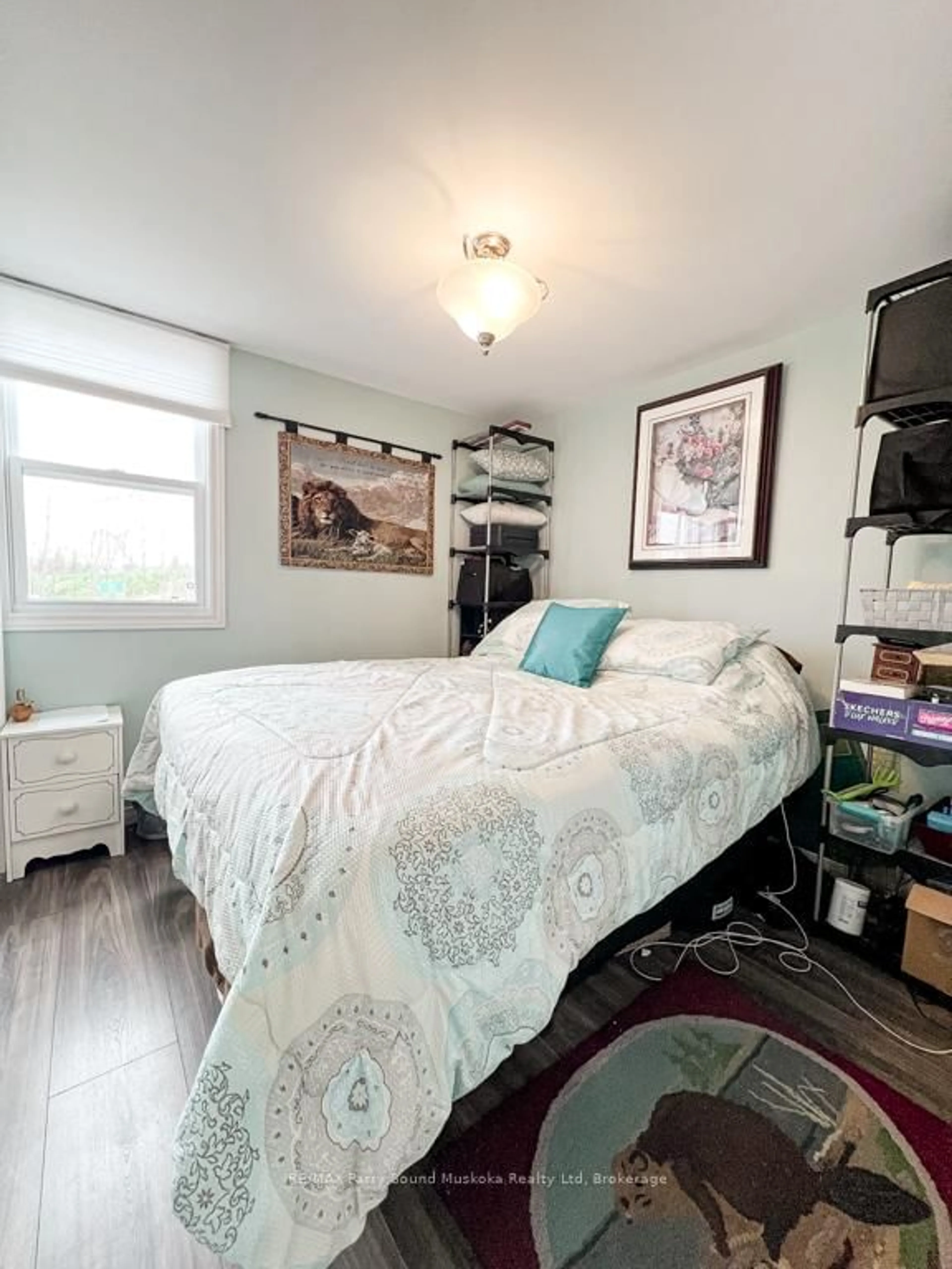 Bedroom with bed, wood/laminate floor for 21 Macfie Rd, Whitestone Ontario P0A 1G0