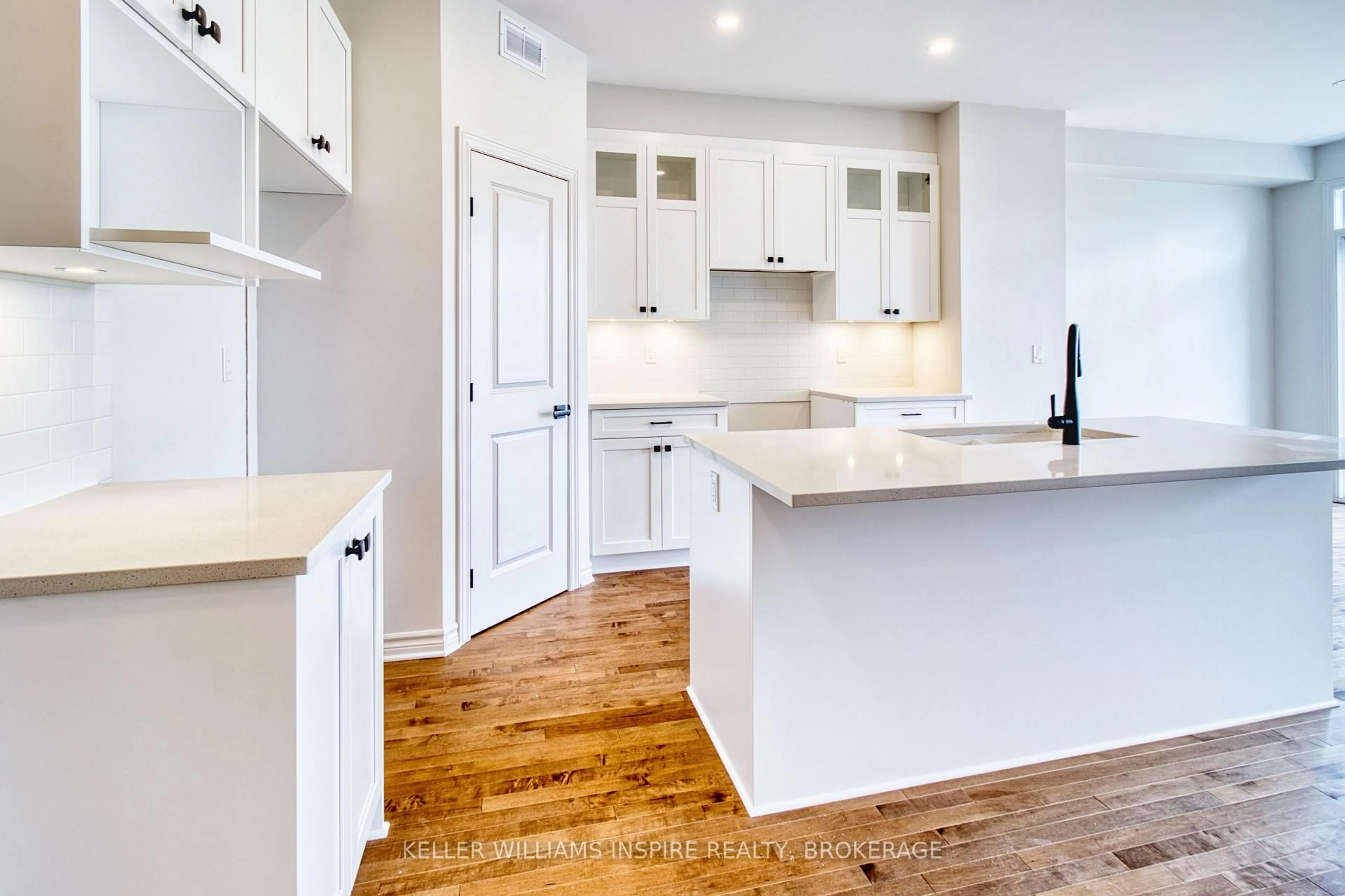 Open concept kitchen, wood/laminate floor for 1408 Demers Ave, Kingston Ontario K7M 0H8