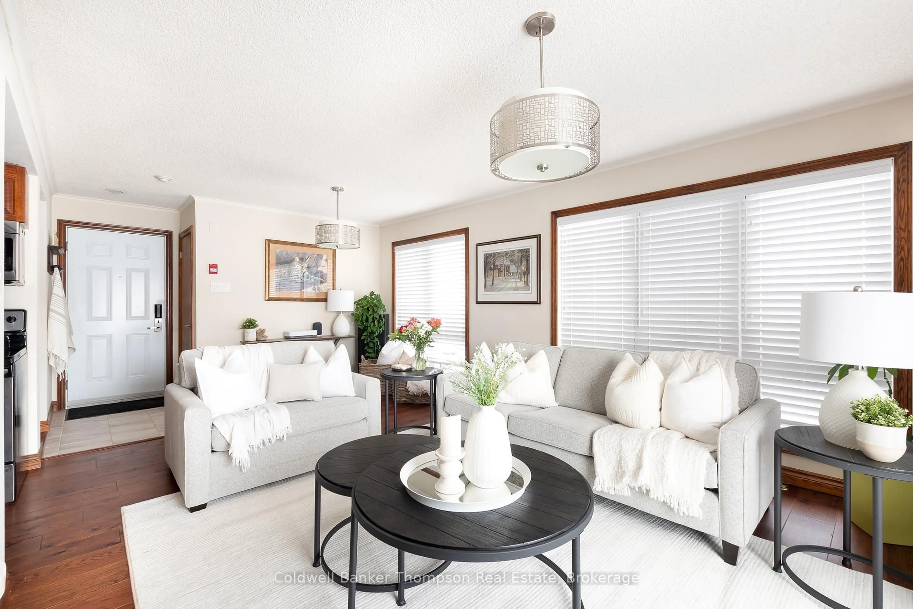 Living room with furniture, ceramic/tile floor for 34 Deerhurst Greens Rd #301, Huntsville Ontario P1H 1A9