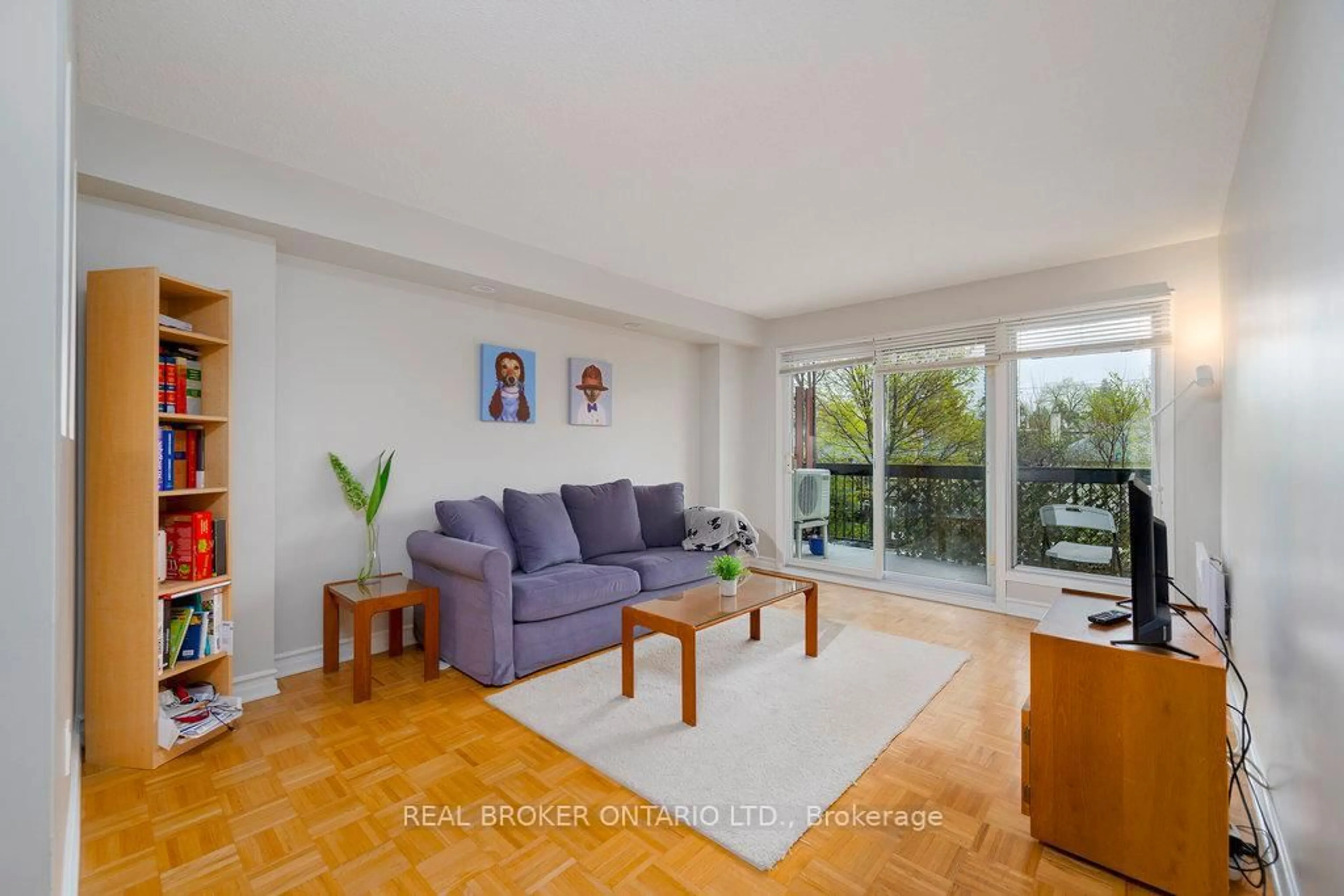 Living room with furniture, wood/laminate floor for 158C McArthur Ave #108, Ottawa Ontario K1L 8E7