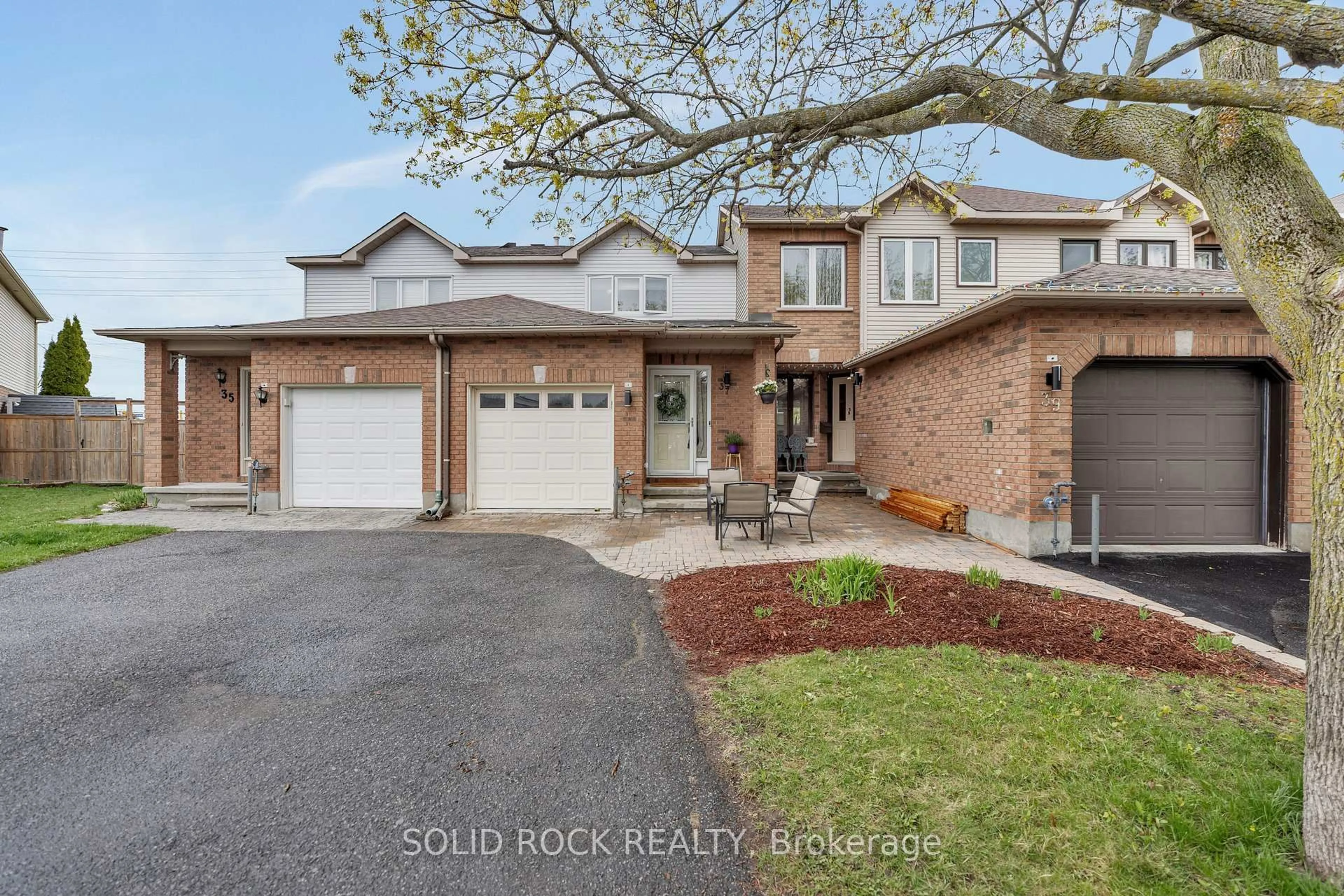 Home with brick exterior material, street for 37 Grenadier Way, Ottawa Ontario K2J 4L3