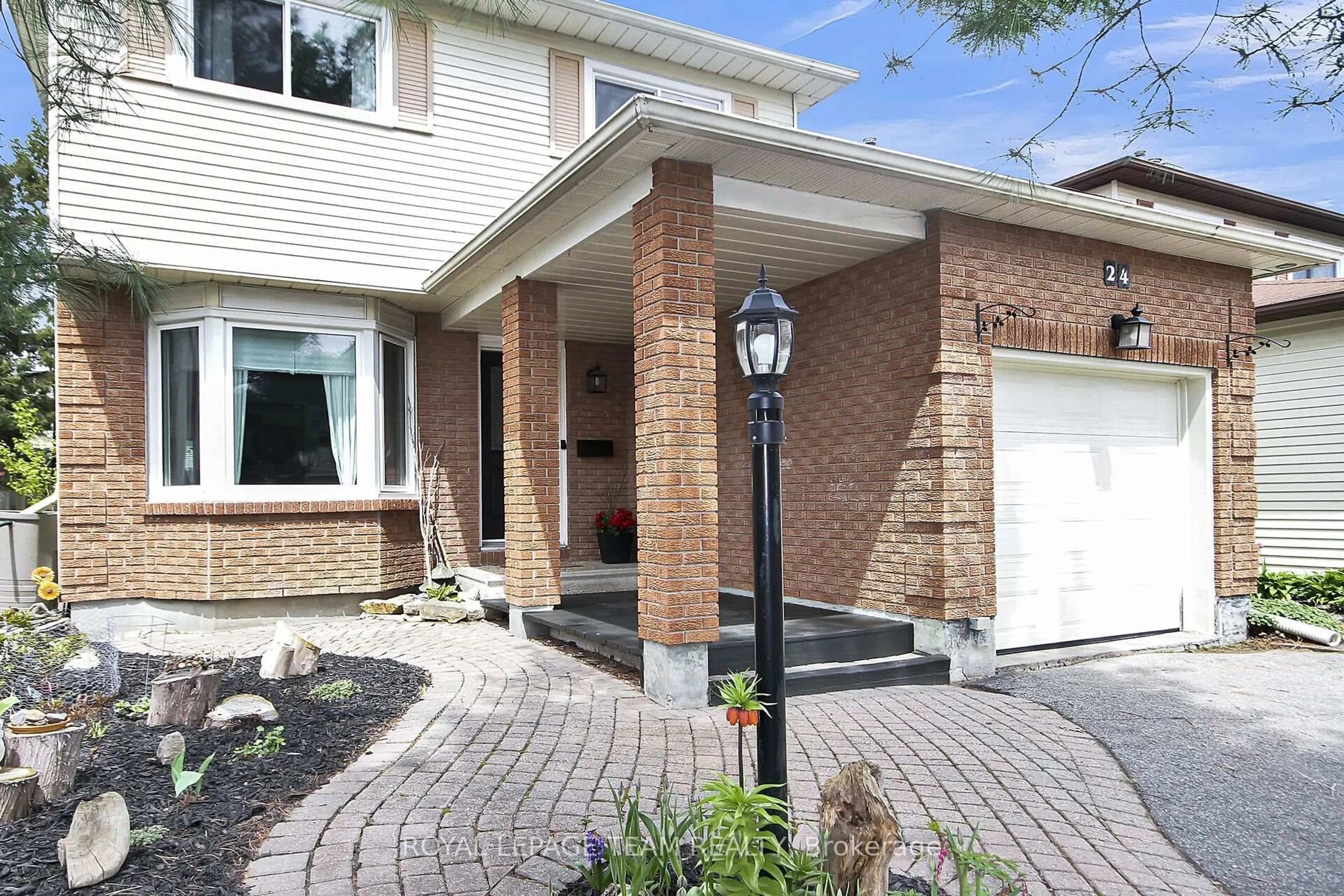 Home with brick exterior material, street for 24 Ready Way, Ottawa Ontario K2J 2R6