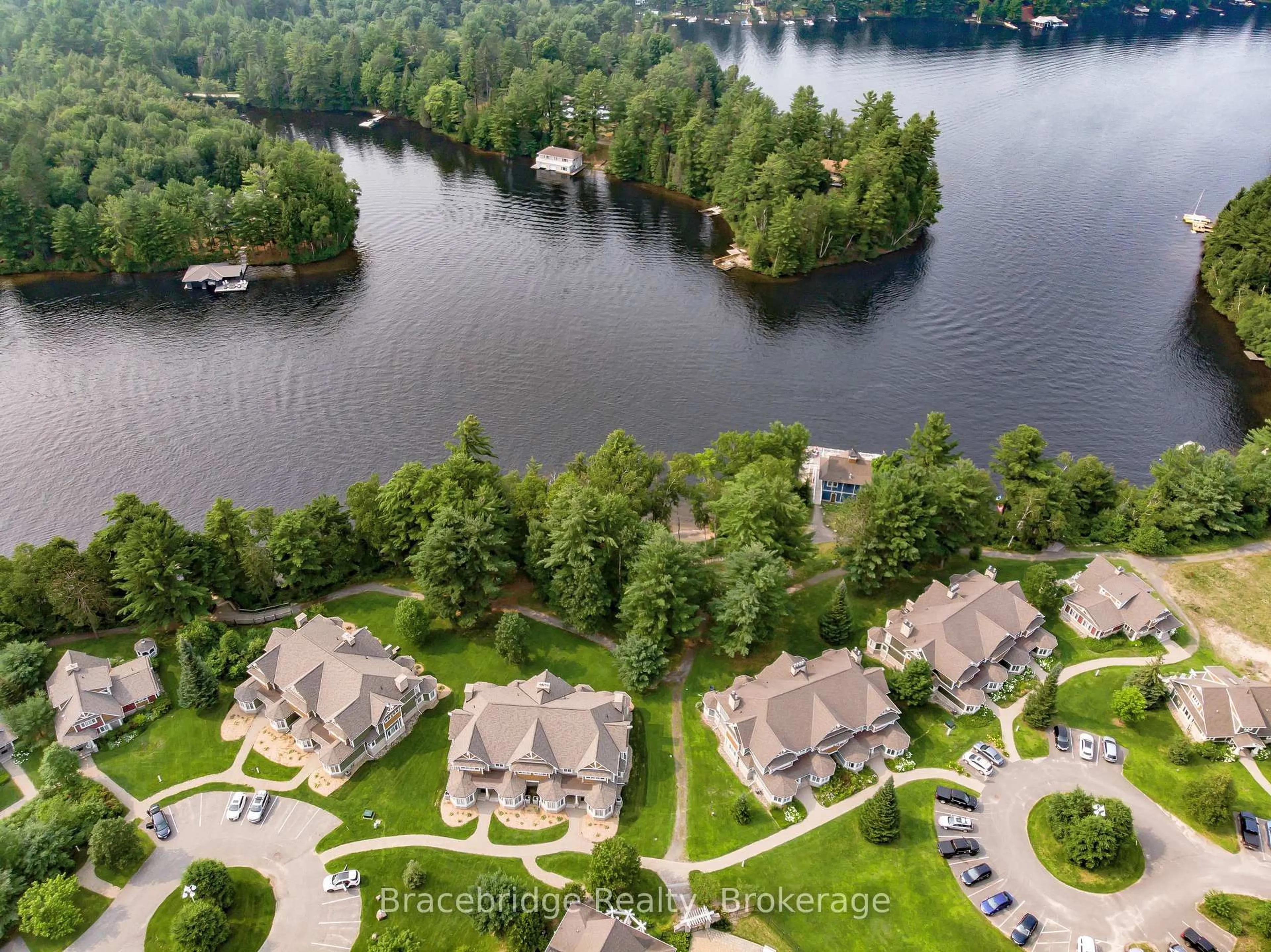 A pic from outside/outdoor area/front of a property/back of a property/a pic from drone, water/lake/river/ocean view for 1020 Birch Glen Rd #Villa W1 or W10, Lake of Bays Ontario P0B 1A0