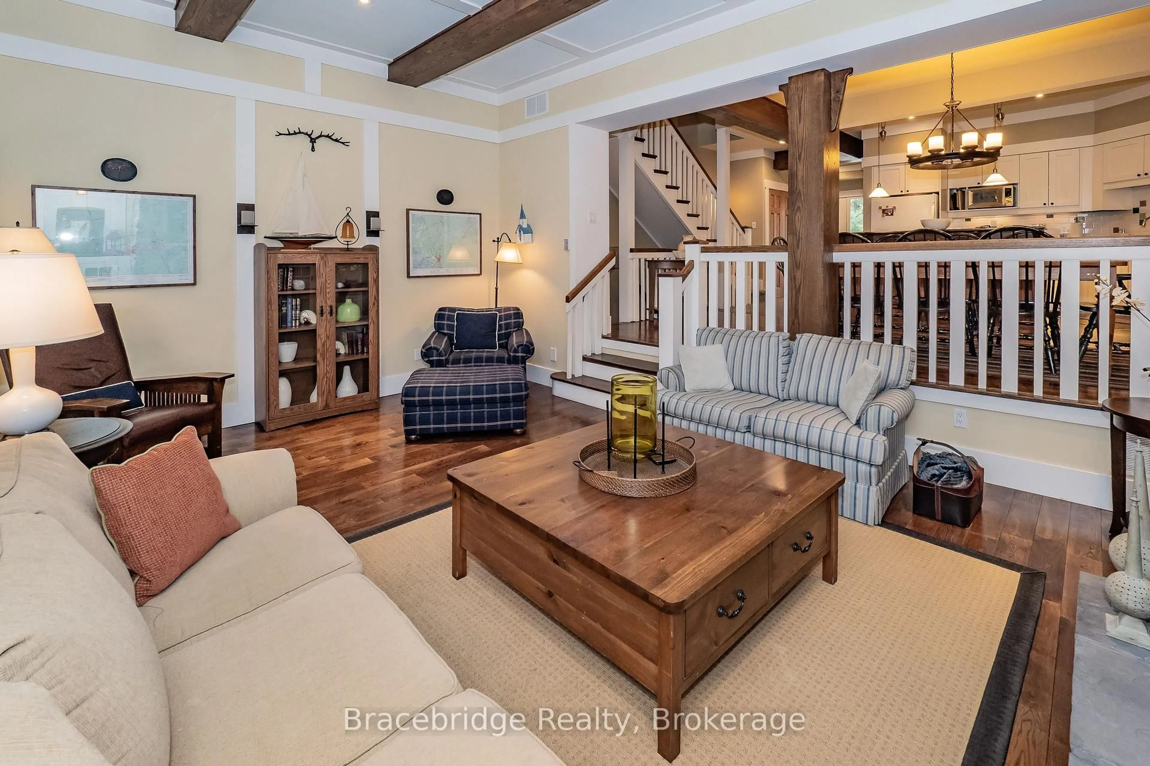 Living room with furniture, wood/laminate floor for 1020 Birch Glen Rd #Villa W1 or W10, Lake of Bays Ontario P0B 1A0