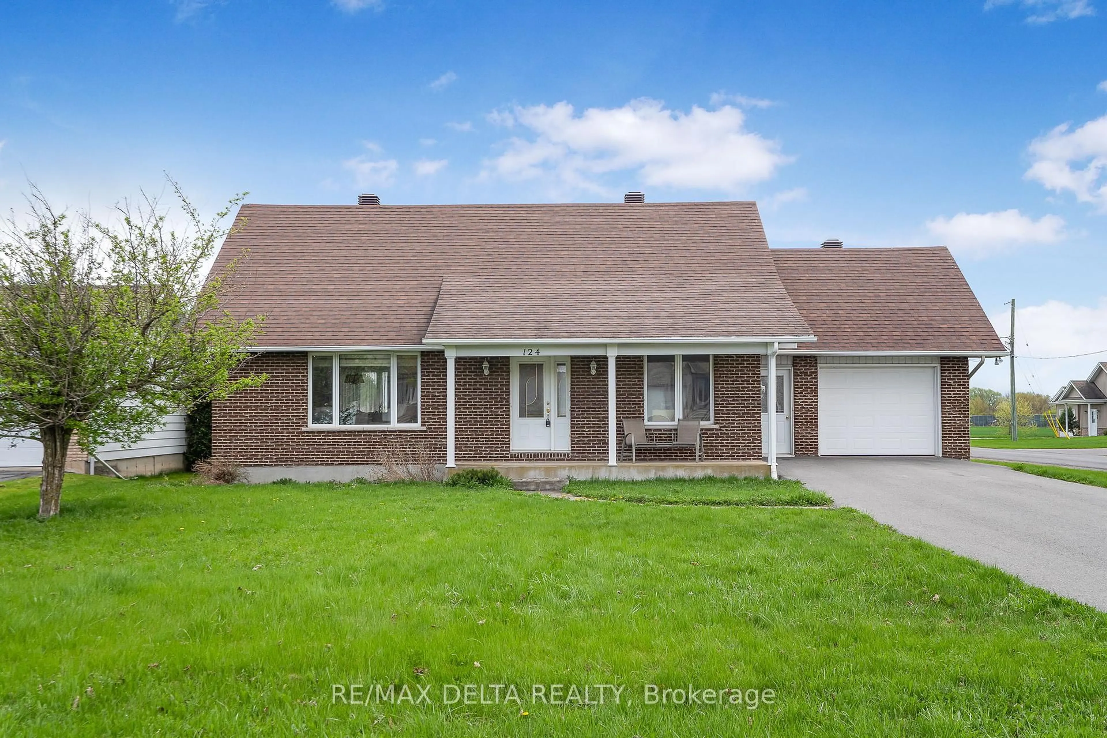 Home with vinyl exterior material, street for 124 Caledonia Rd. Rd, The Nation Ontario K0C 2B0