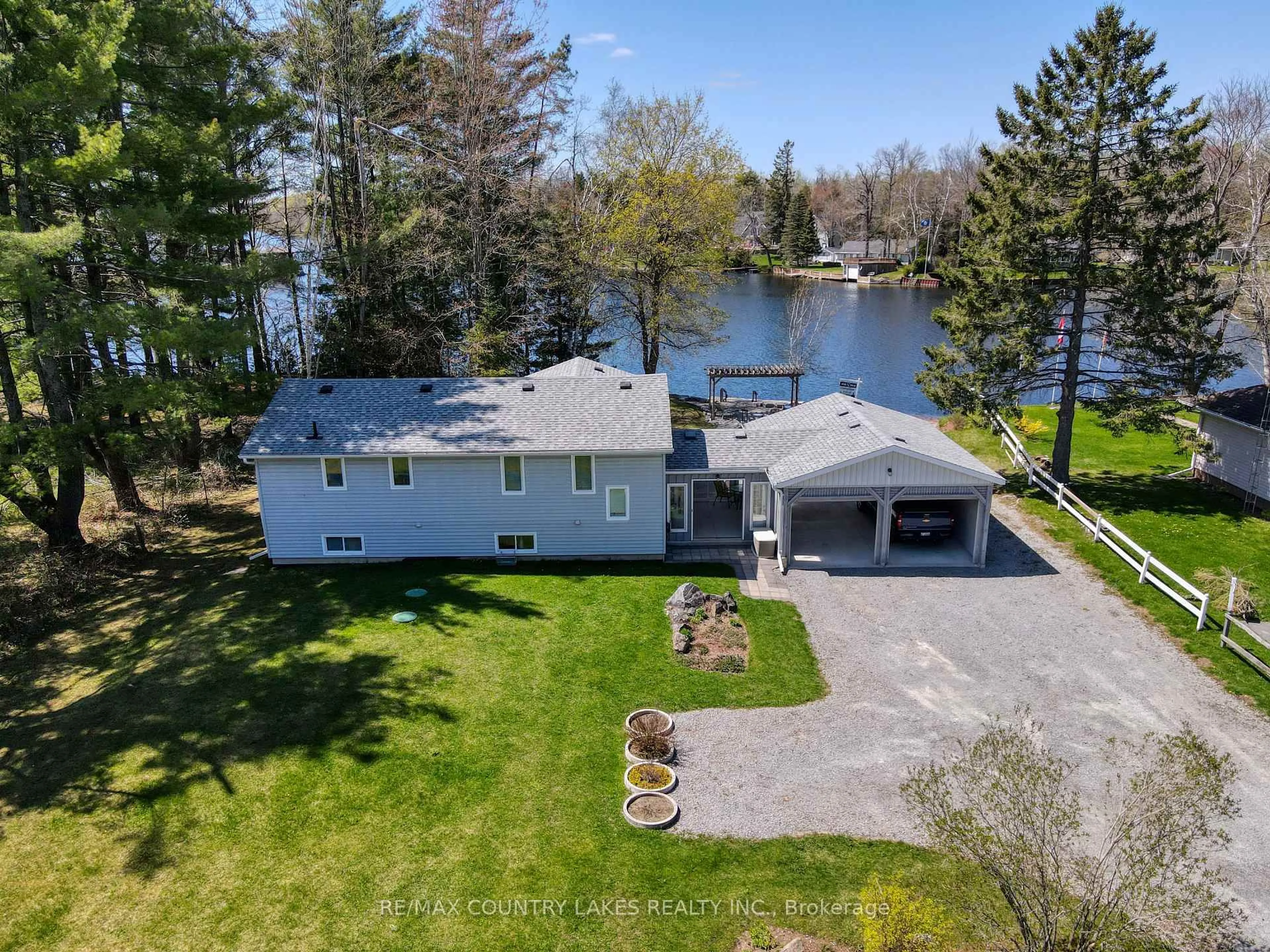 A pic from outside/outdoor area/front of a property/back of a property/a pic from drone, water/lake/river/ocean view for 31 Portage Rd, Kawartha Lakes Ontario K0M 2T0