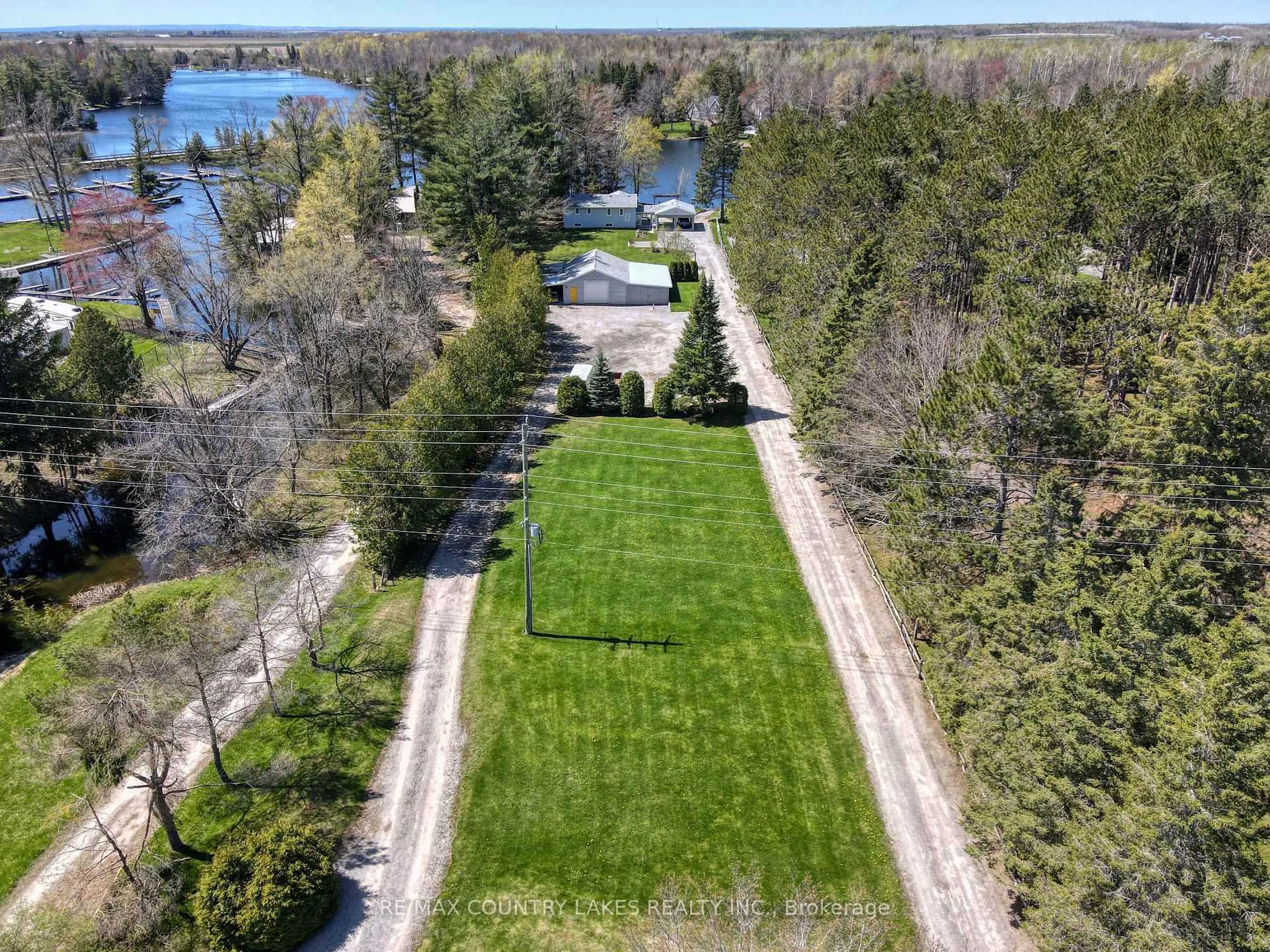A pic from outside/outdoor area/front of a property/back of a property/a pic from drone, water/lake/river/ocean view for 31 Portage Rd, Kawartha Lakes Ontario K0M 2T0
