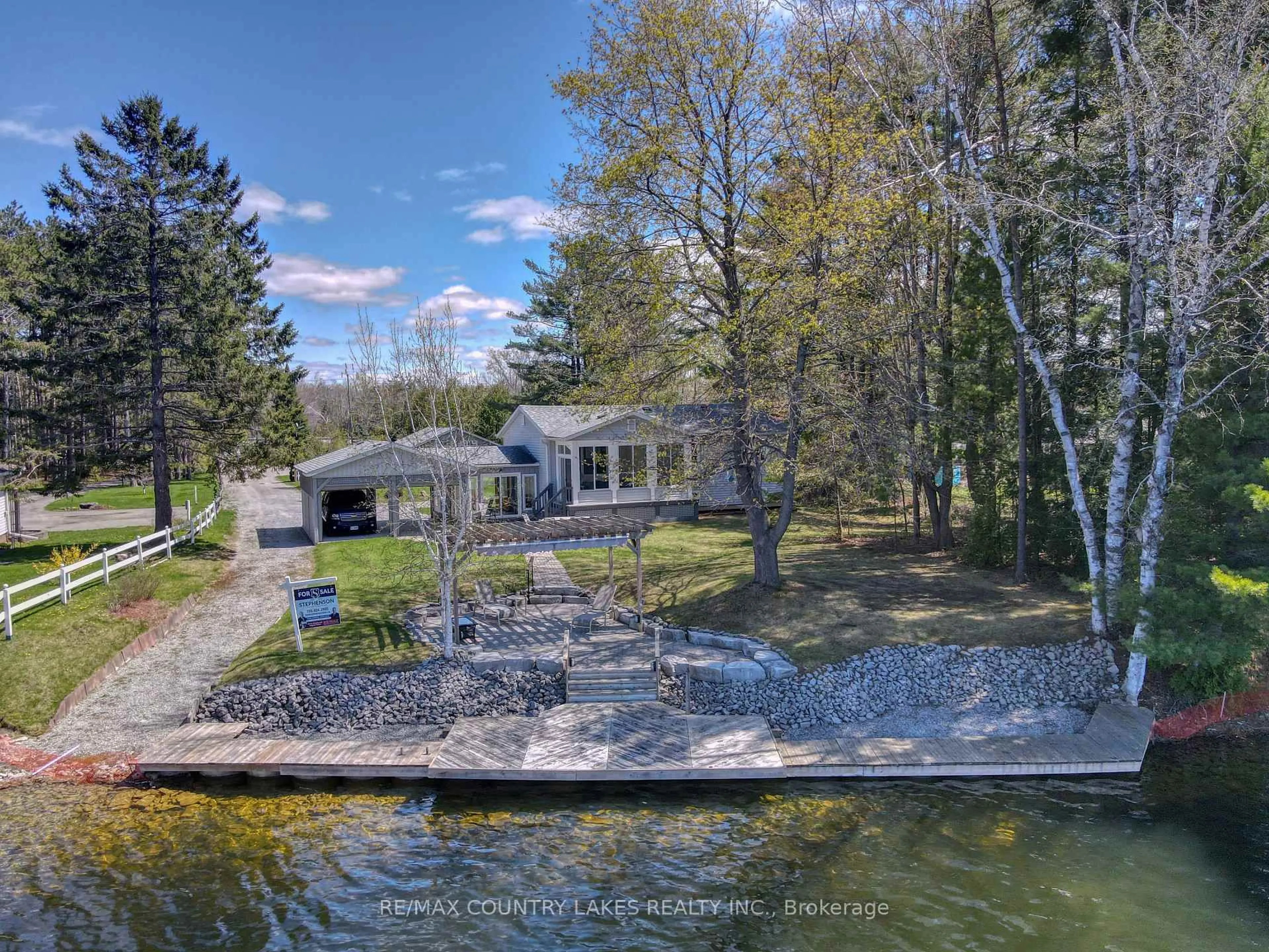 A pic from outside/outdoor area/front of a property/back of a property/a pic from drone, water/lake/river/ocean view for 31 Portage Rd, Kawartha Lakes Ontario K0M 2T0