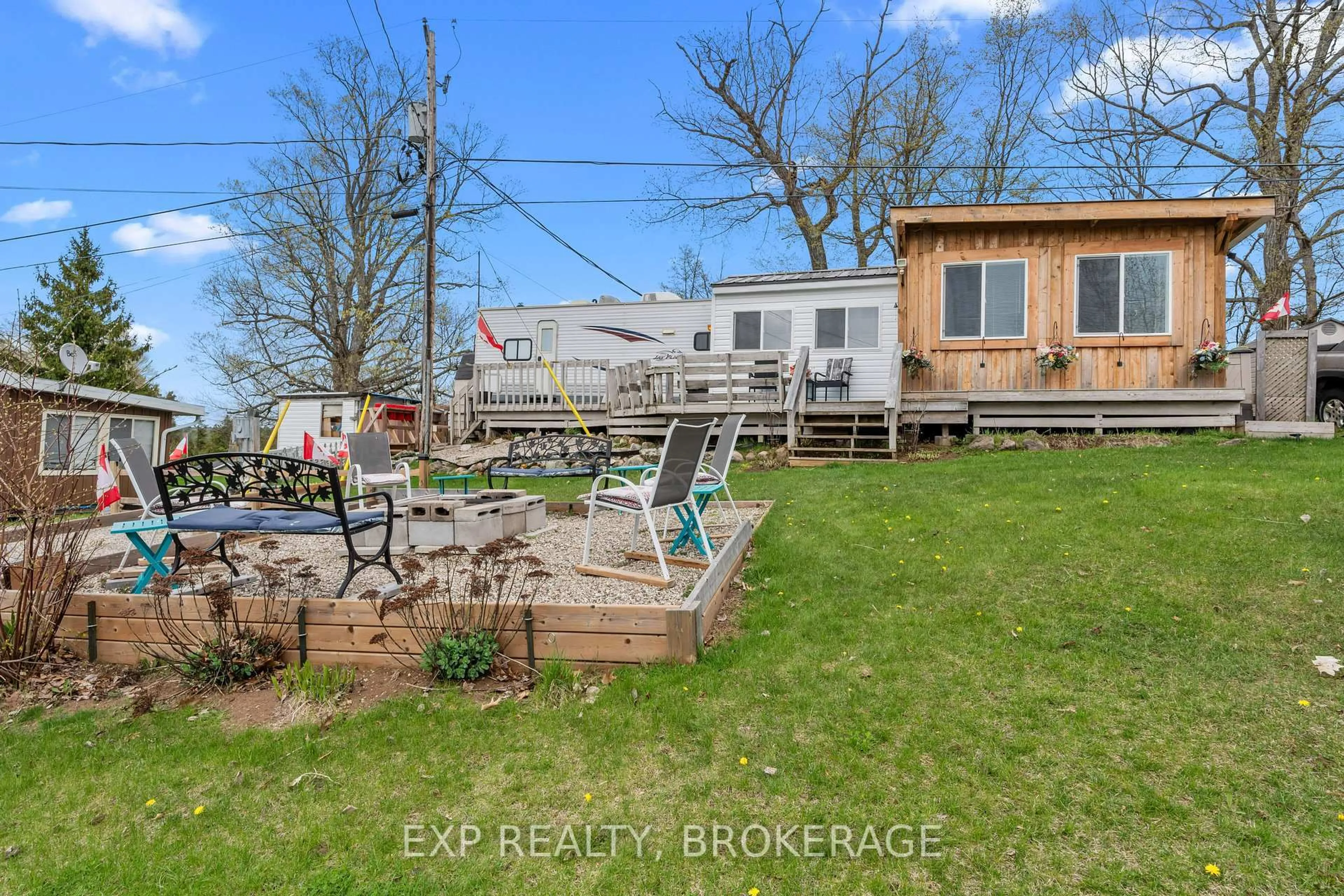 A pic from outside/outdoor area/front of a property/back of a property/a pic from drone, water/lake/river/ocean view for 9 GLENFORD Lane ##38, Godfrey Ontario K0H 1T0