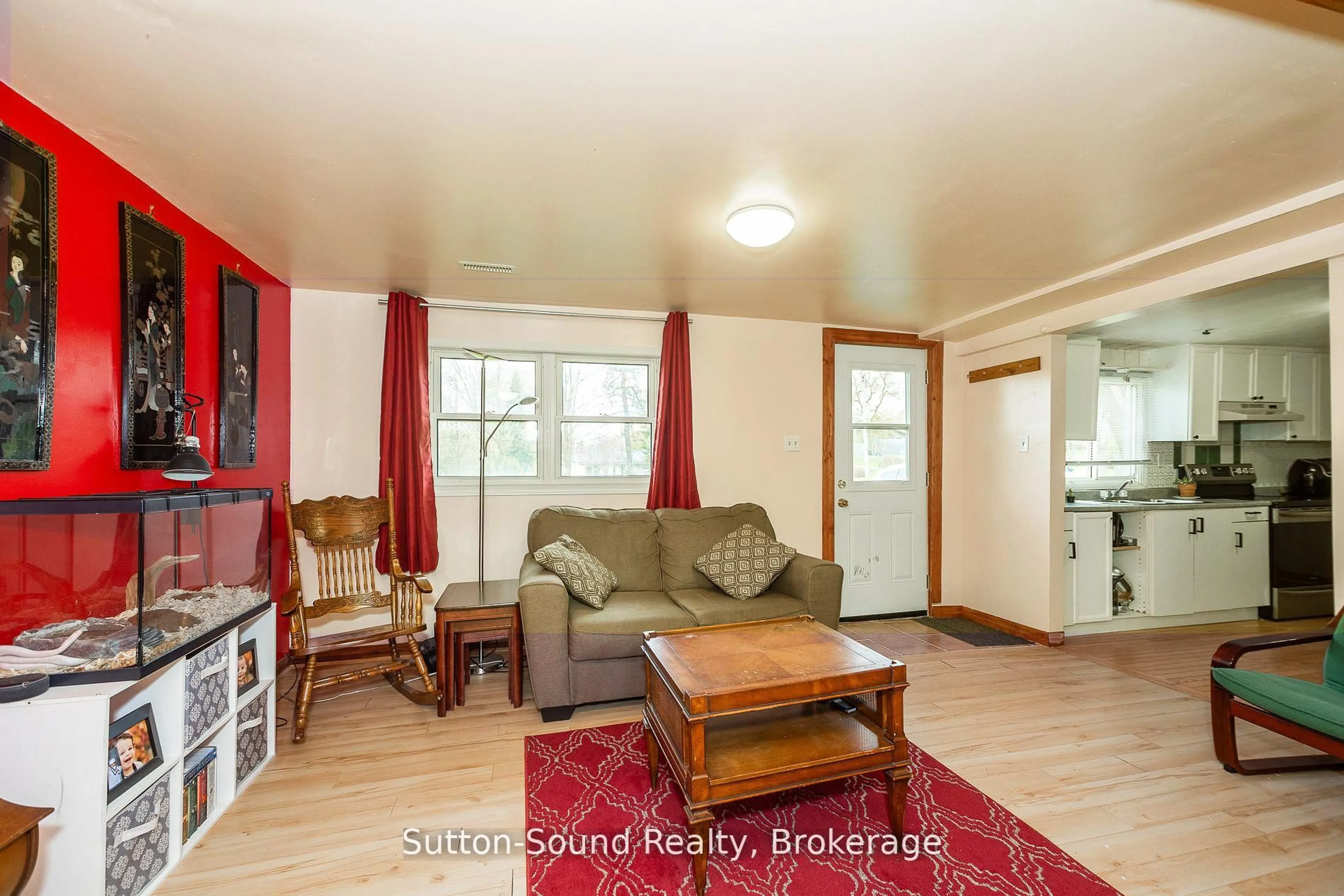 Living room with furniture, wood/laminate floor for 776225 Highway 10 Highway, Chatsworth Ontario N0H 1C0