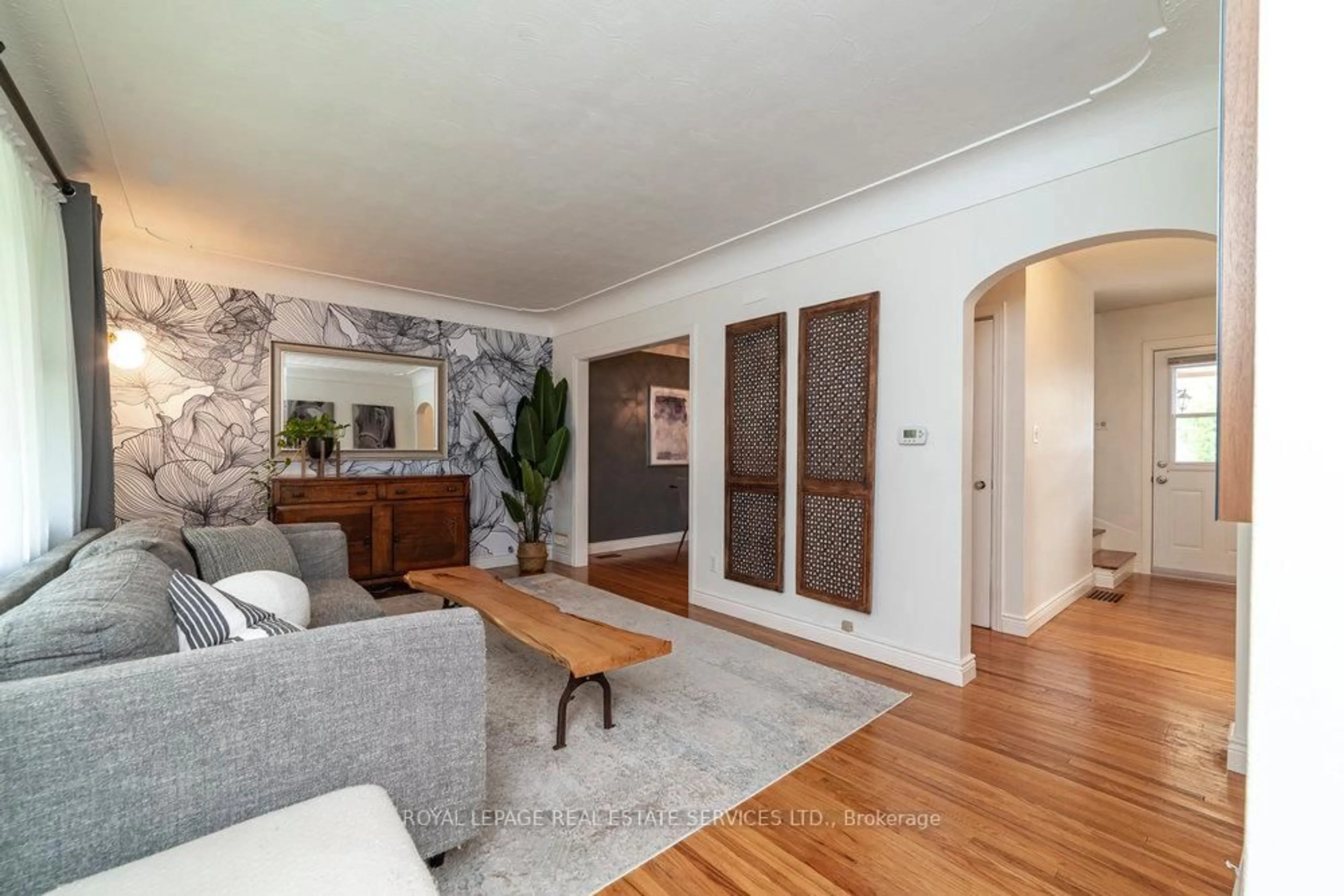 Living room with furniture, wood/laminate floor for 16 McKay Rd, Hamilton Ontario L9H 1H5