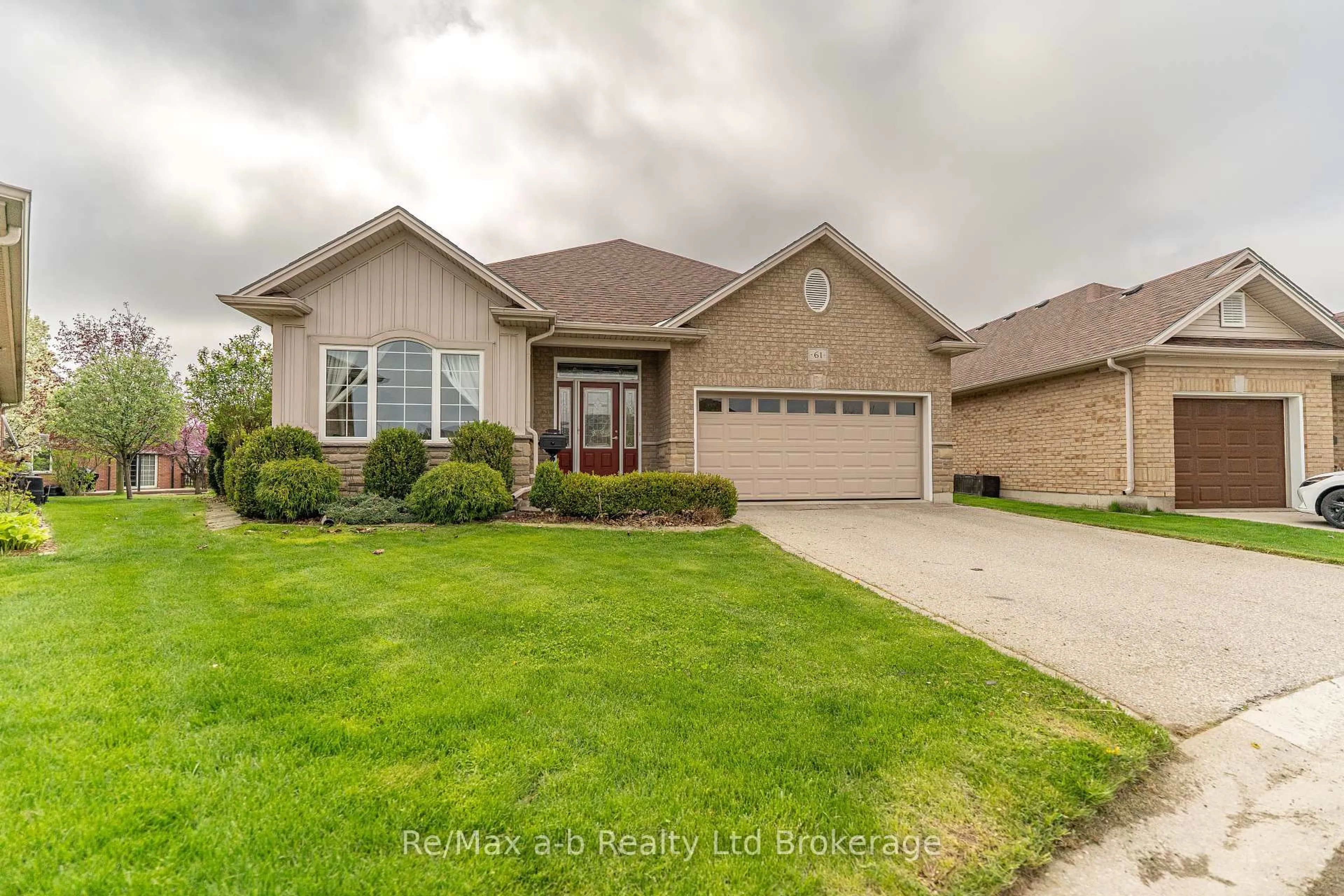 Home with brick exterior material, street for 61 Jones Cres, Tillsonburg Ontario N4G 5X5