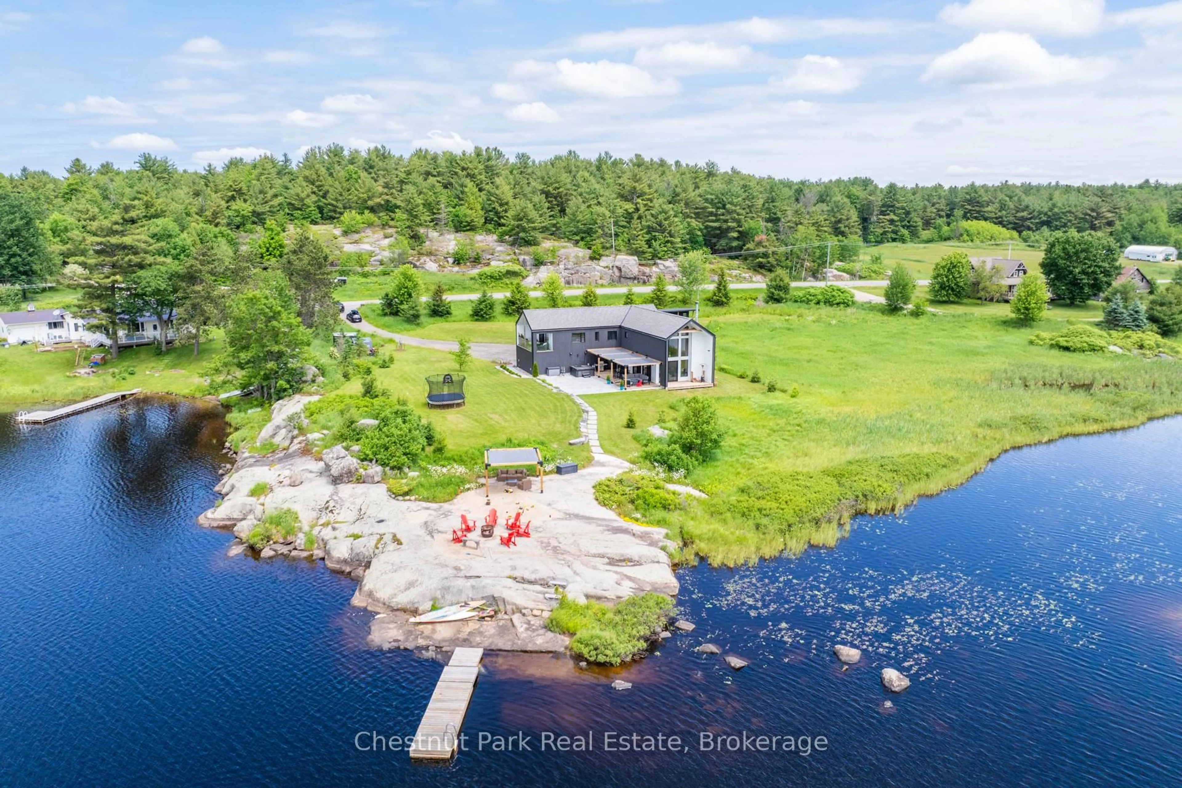 A pic from outside/outdoor area/front of a property/back of a property/a pic from drone, water/lake/river/ocean view for 1594 Doe Lake Rd, Gravenhurst Ontario P1P 1R3