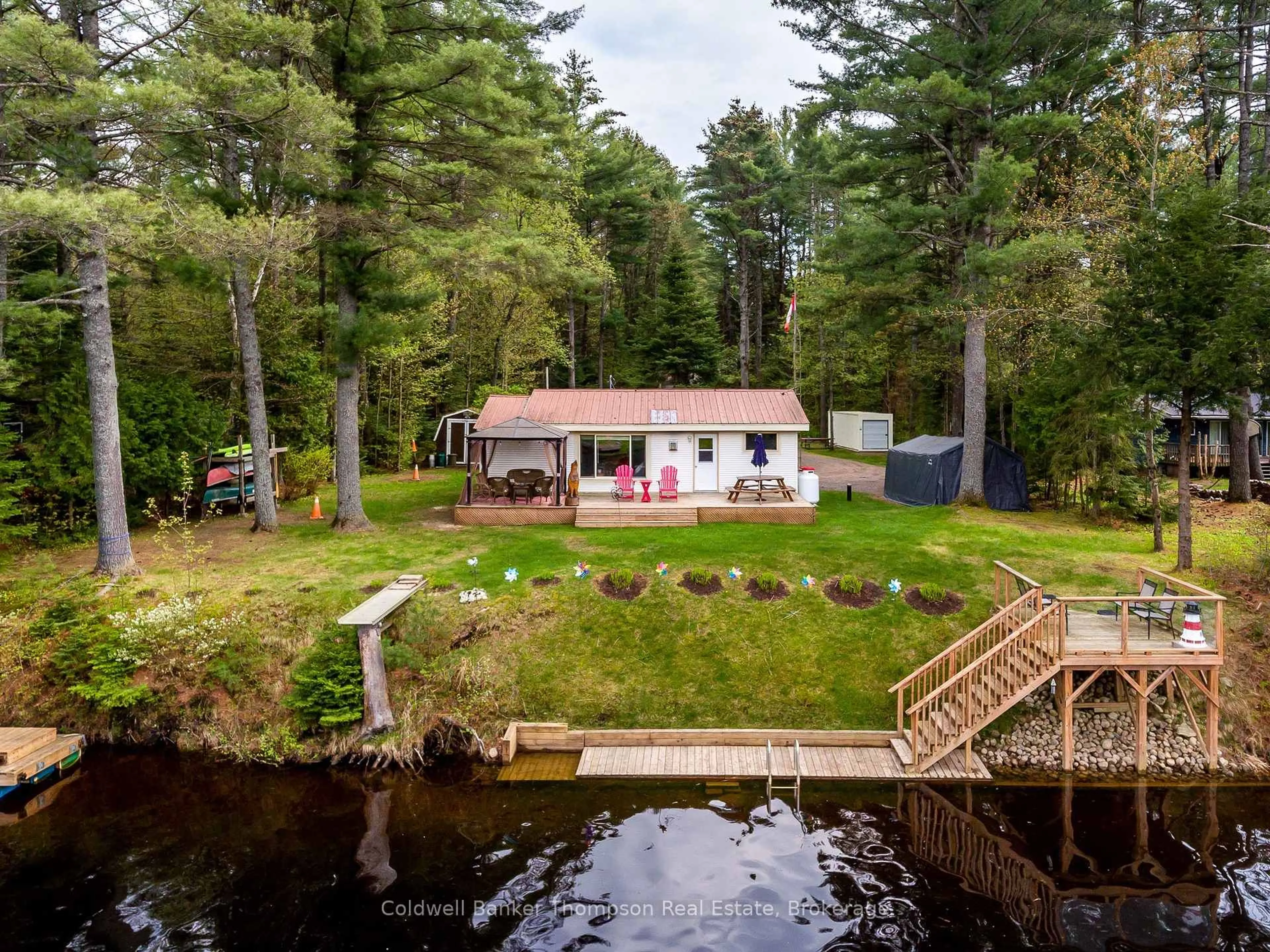 A pic from outside/outdoor area/front of a property/back of a property/a pic from drone, water/lake/river/ocean view for 553 BALSAM CHUTES Rd, Huntsville Ontario P0B 1L0