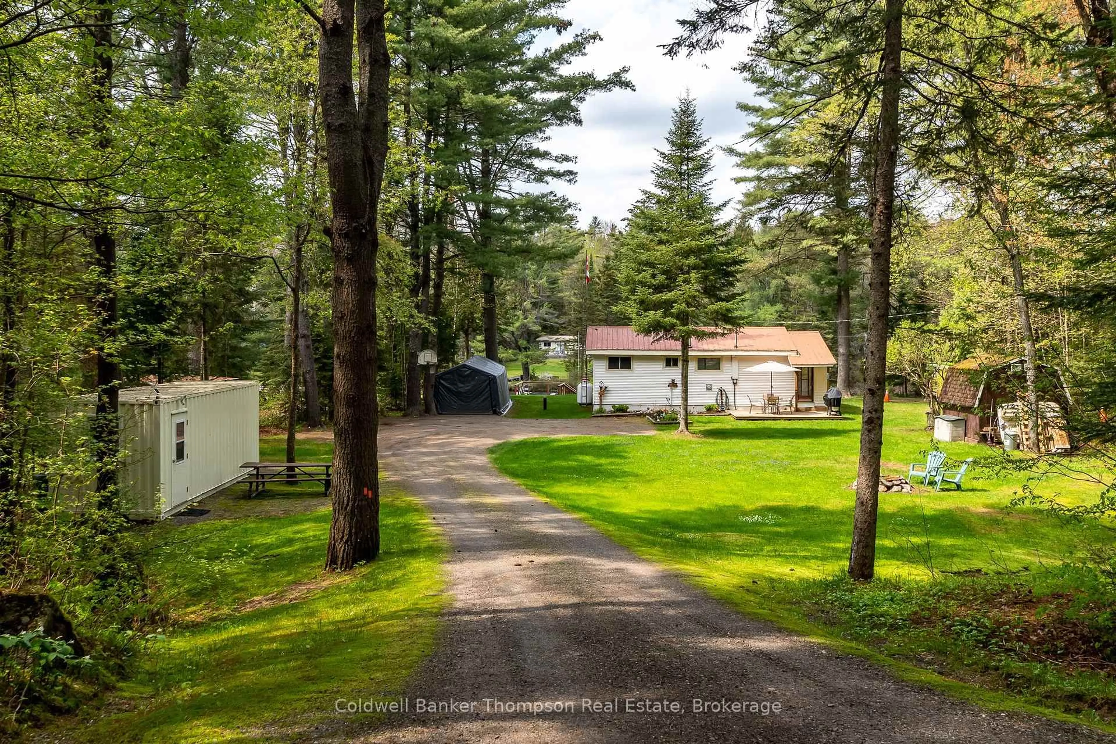 A pic from outside/outdoor area/front of a property/back of a property/a pic from drone, forest/trees view for 553 BALSAM CHUTES Rd, Huntsville Ontario P0B 1L0