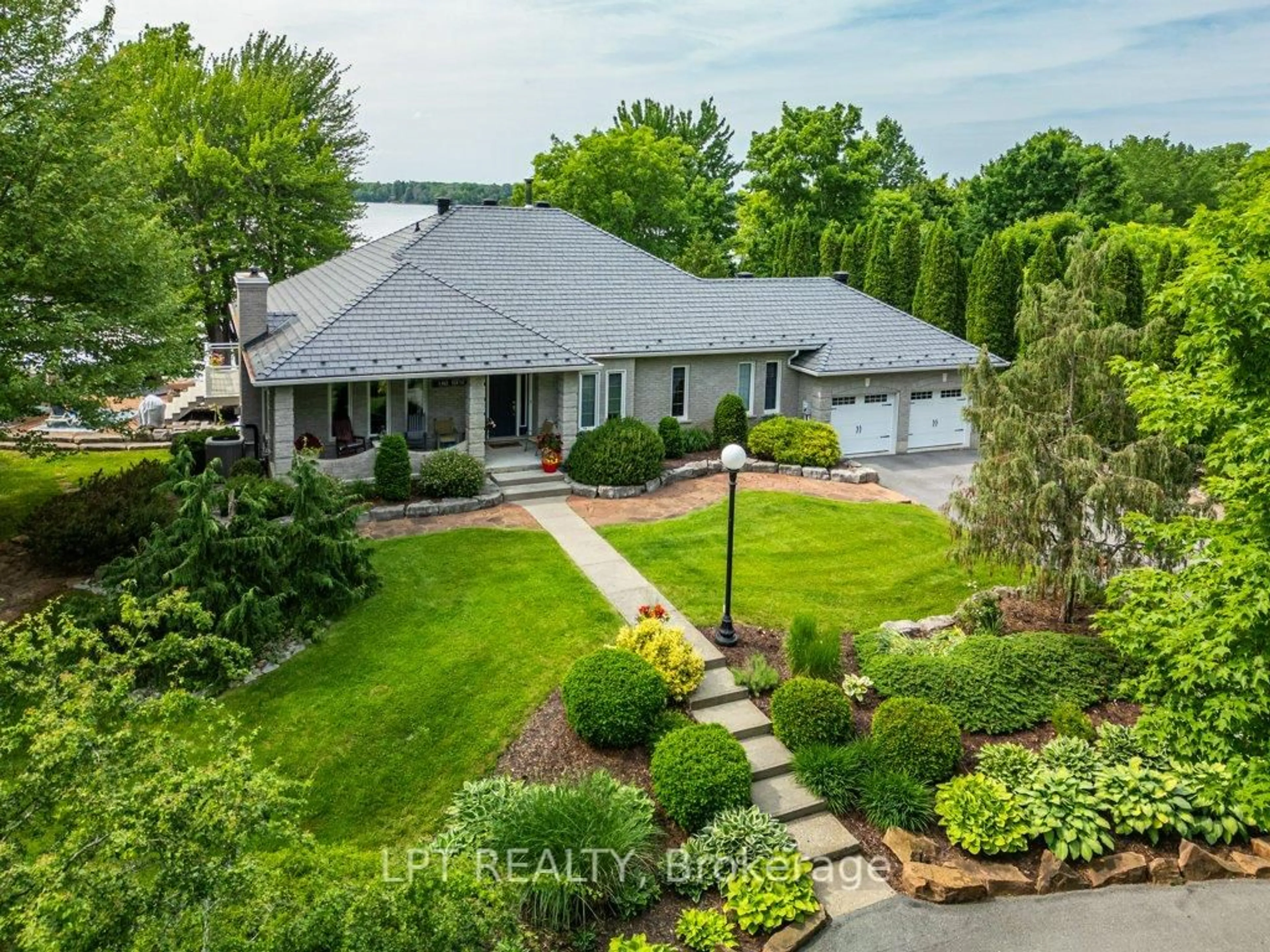 A pic from outside/outdoor area/front of a property/back of a property/a pic from drone, water/lake/river/ocean view for 3909 Stone Point Rd, Napanee Ontario K7R 3K7