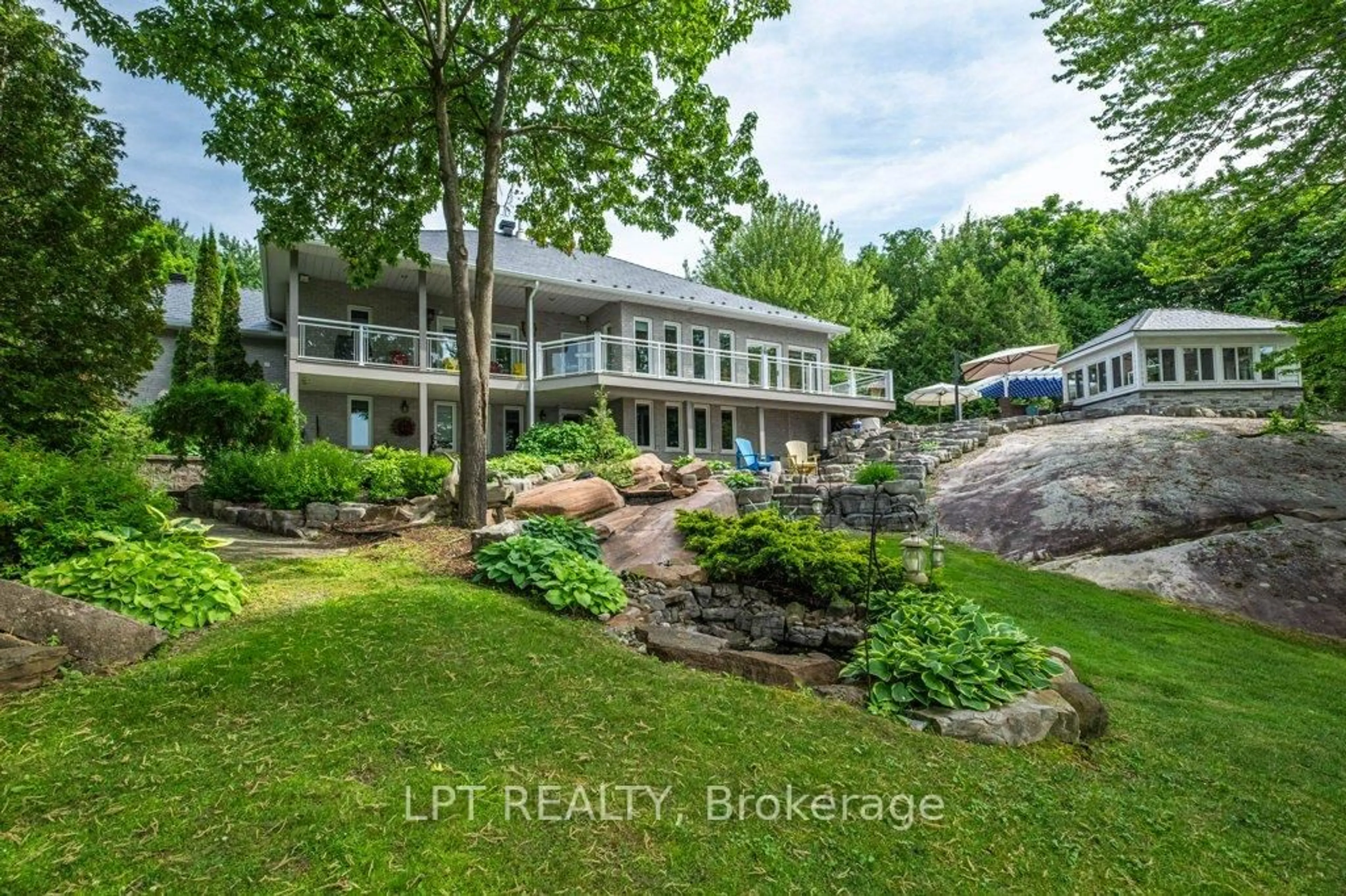 A pic from outside/outdoor area/front of a property/back of a property/a pic from drone, water/lake/river/ocean view for 3909 Stone Point Rd, Napanee Ontario K7R 3K7