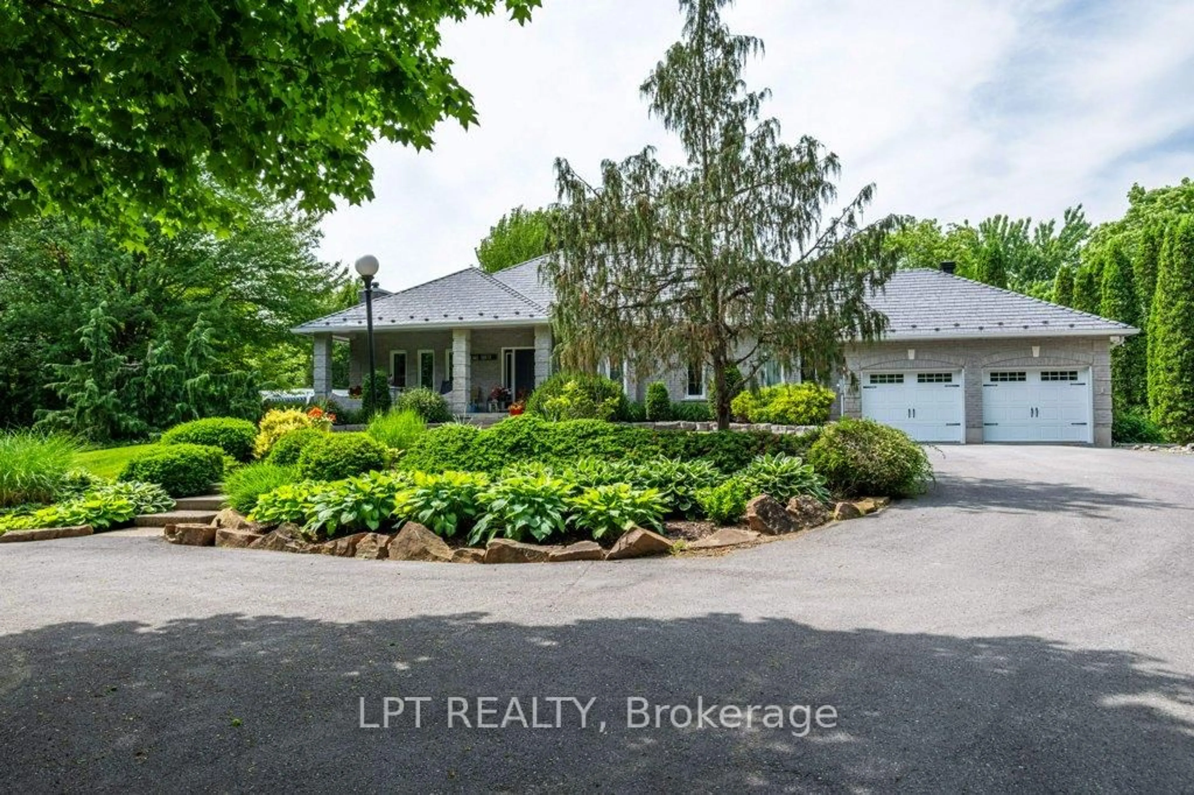 A pic from outside/outdoor area/front of a property/back of a property/a pic from drone, street for 3909 Stone Point Rd, Napanee Ontario K7R 3K7