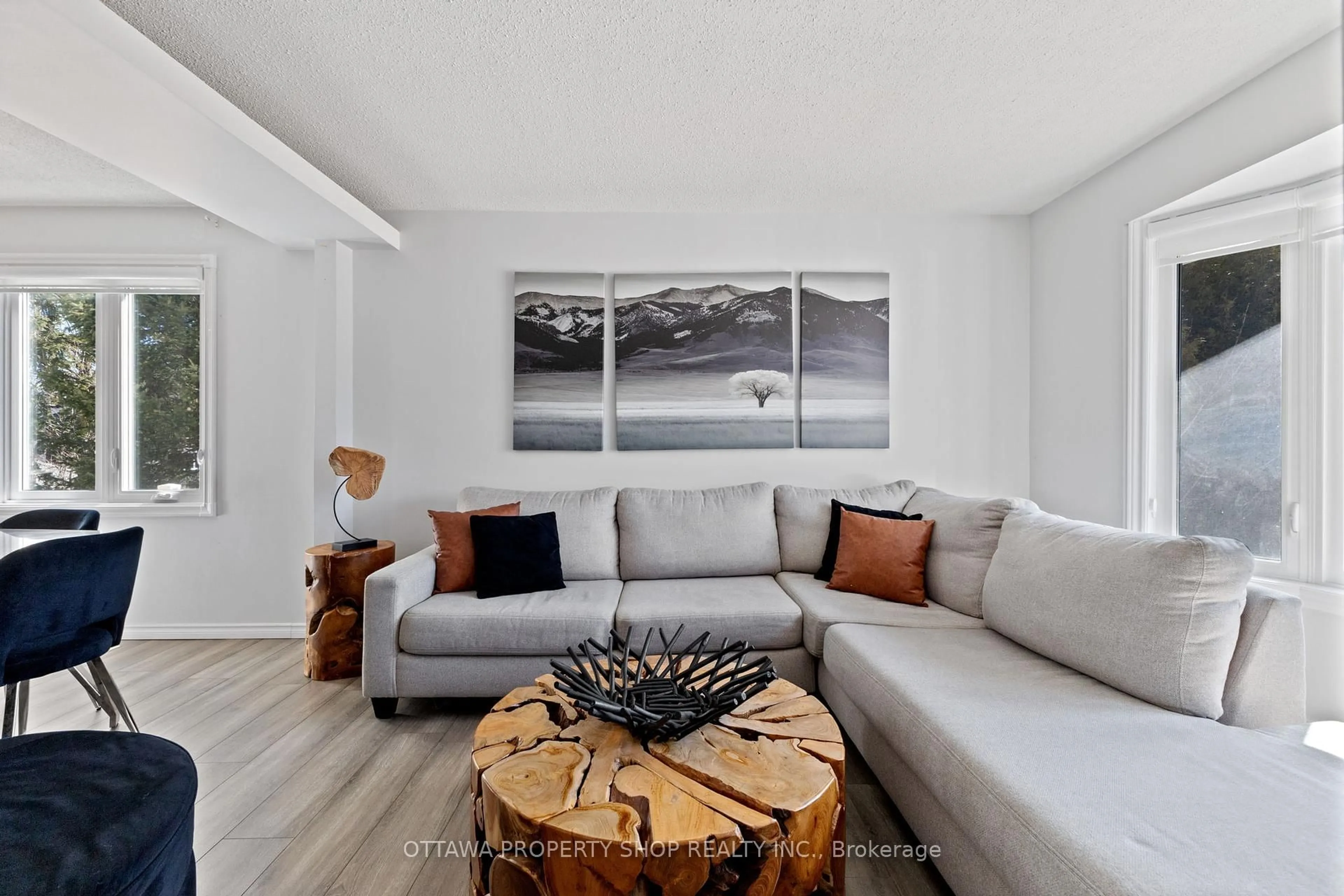 Living room with furniture, wood/laminate floor for 2837 Gothwood Pl, Ottawa Ontario K1T 2V4