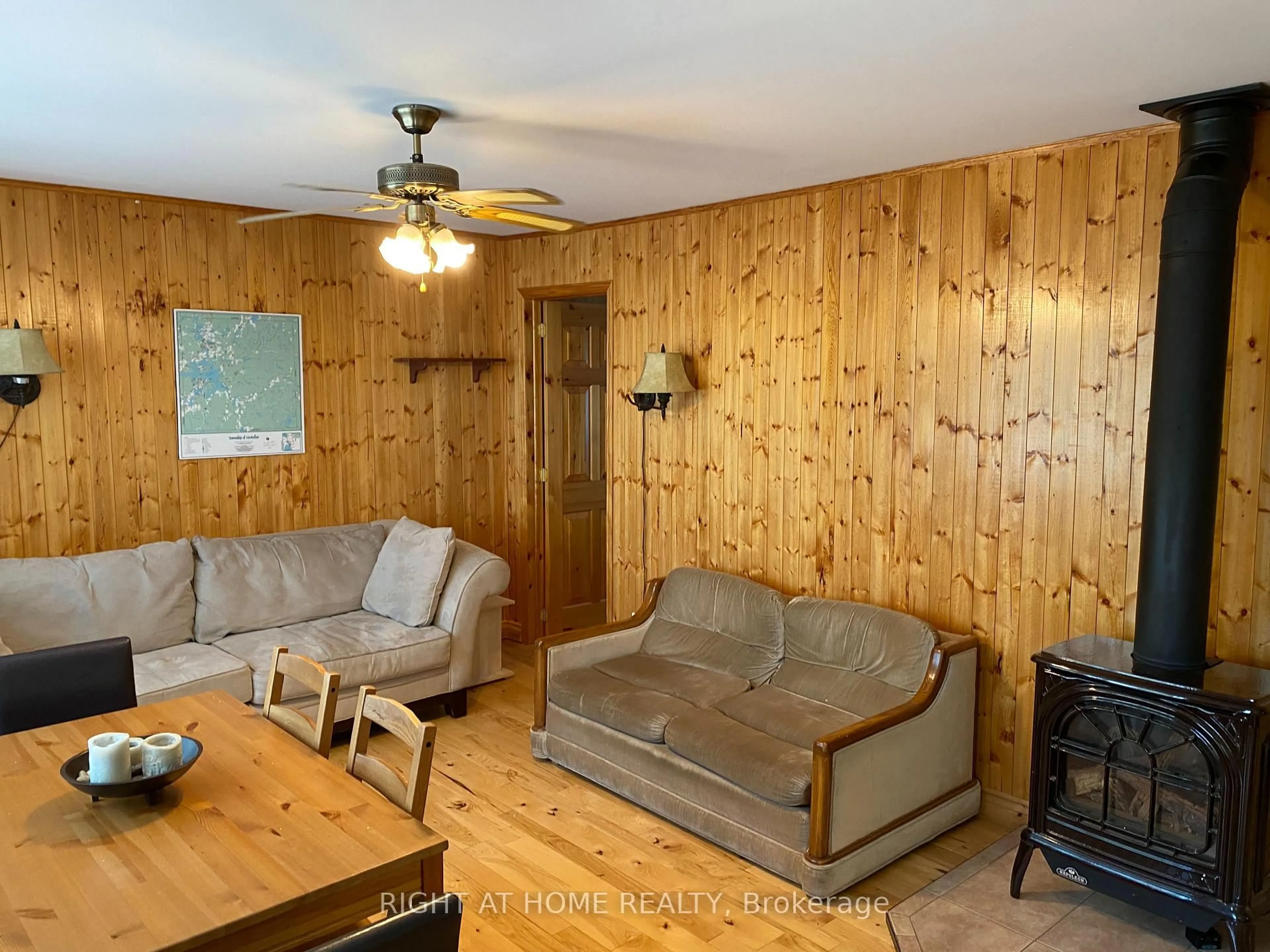 Living room with furniture, wood/laminate floor for 104 Lakeside Dr, McKellar Ontario P2A 0B4