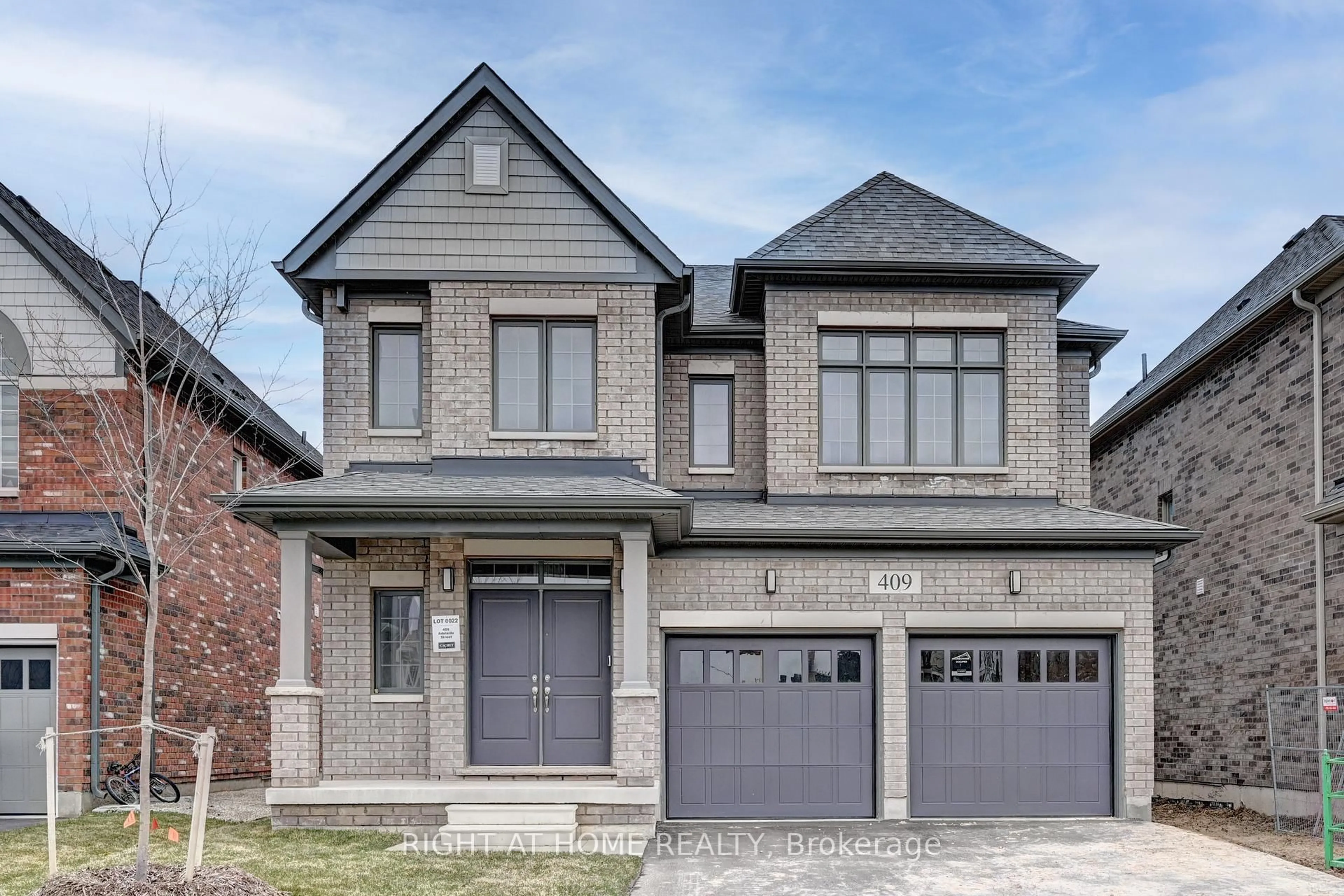 Home with brick exterior material, street for 409 Adelaide St, Wellington North Ontario N0G 1A0