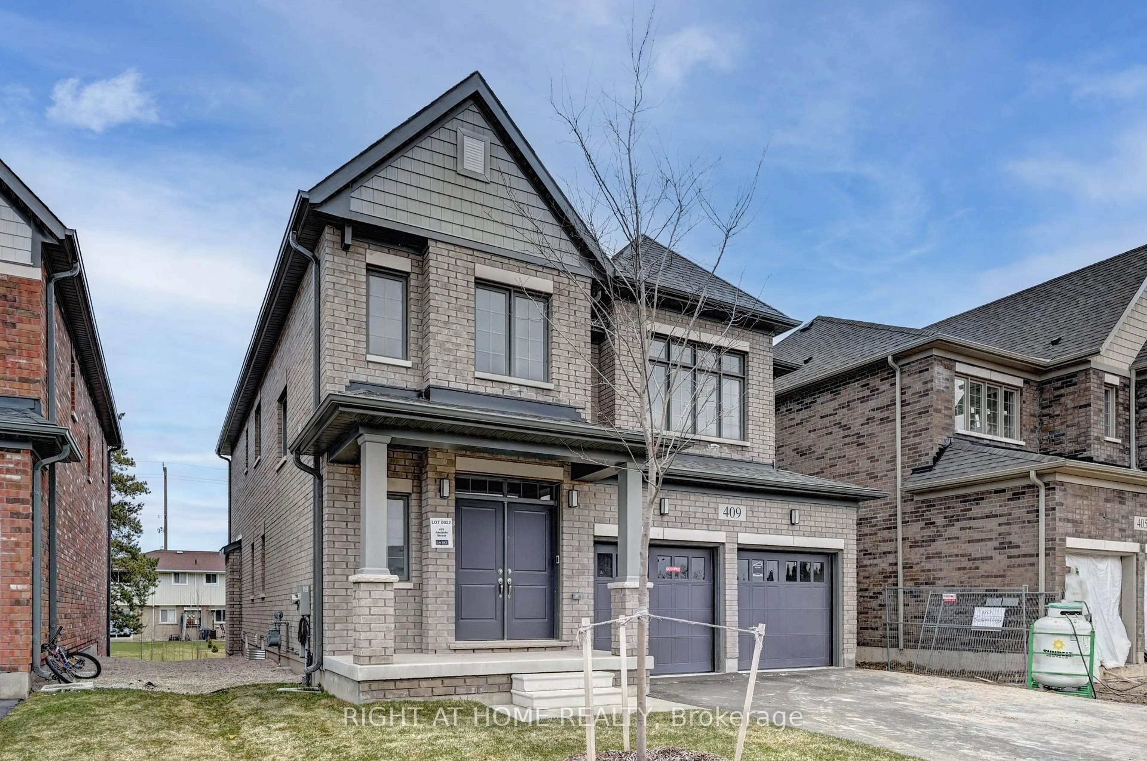 Home with brick exterior material, street for 409 Adelaide St, Wellington North Ontario N0G 1A0